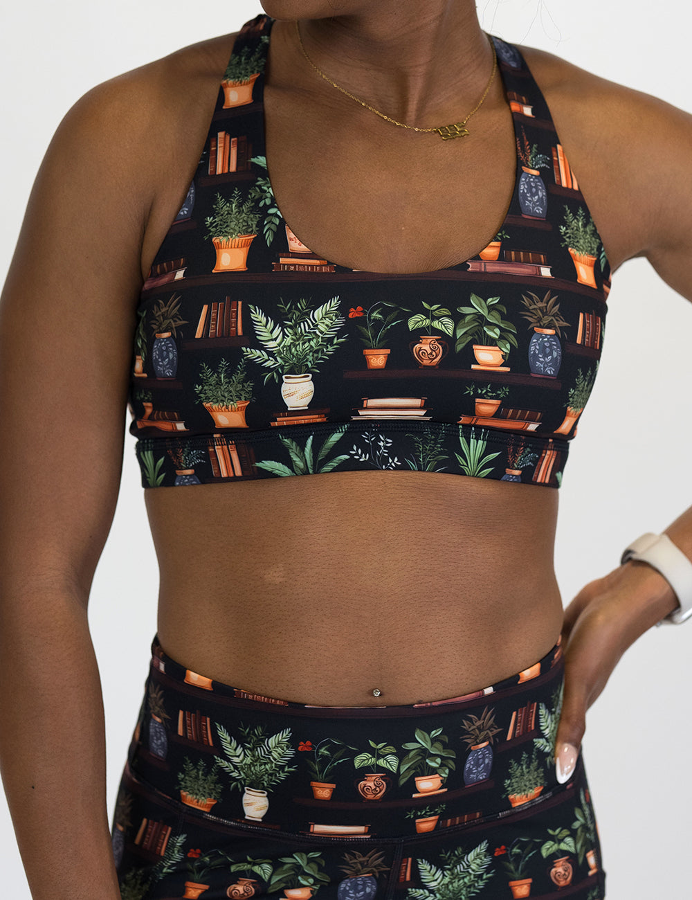 floral patterned sports bra with books design on it