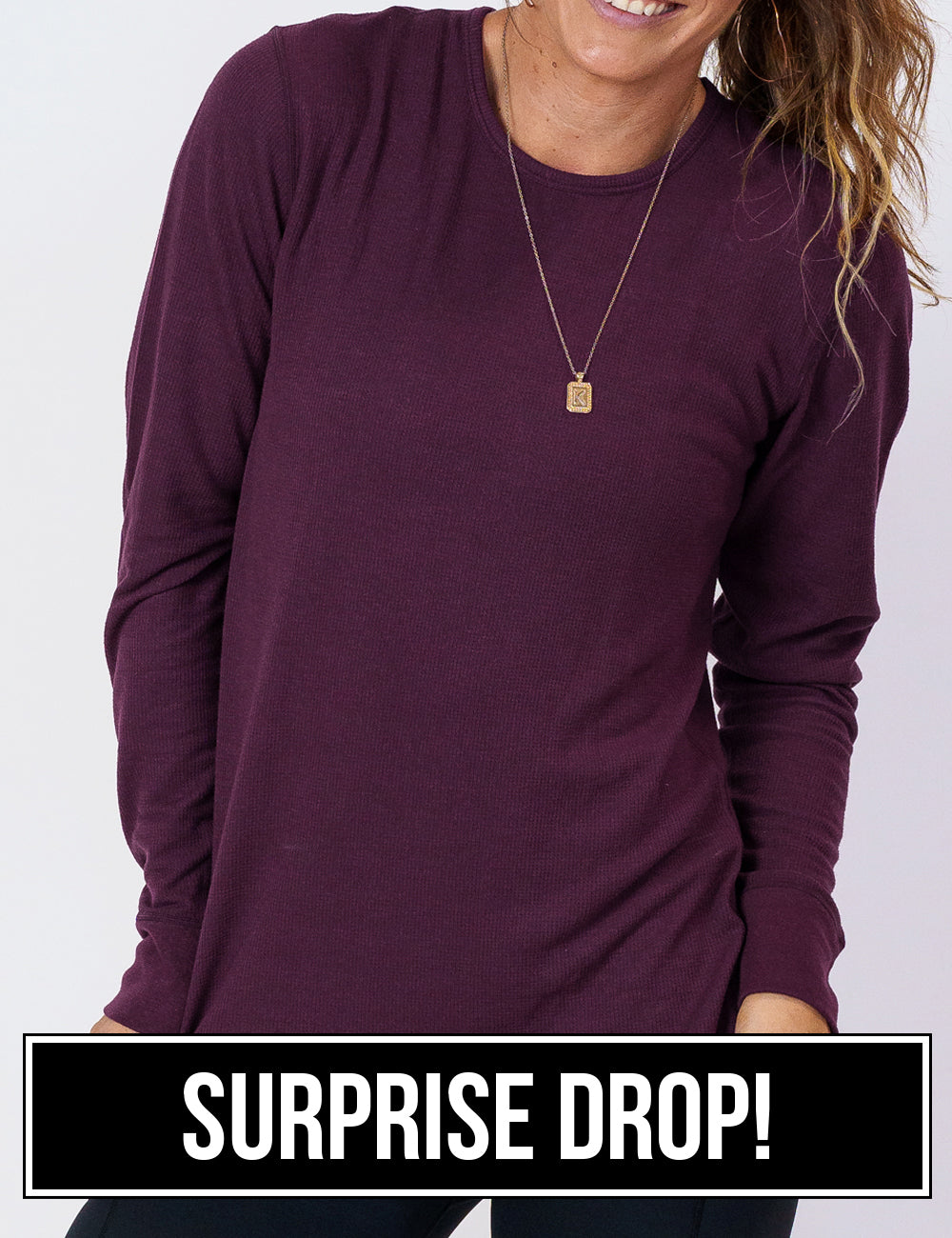 front of the berry purple thermal against a white background, surprise drop