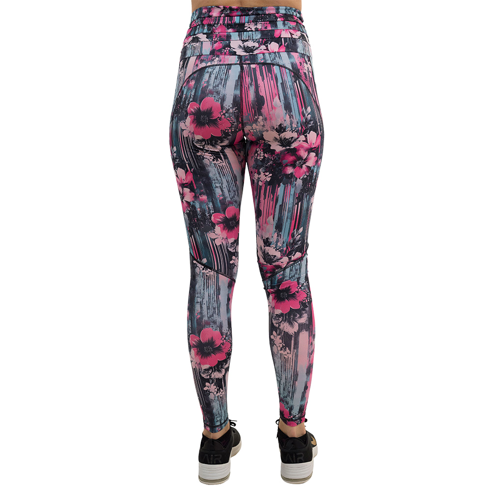 back of the full length pink flowers against a bold teal and pink striped background pattern leggings against a white background