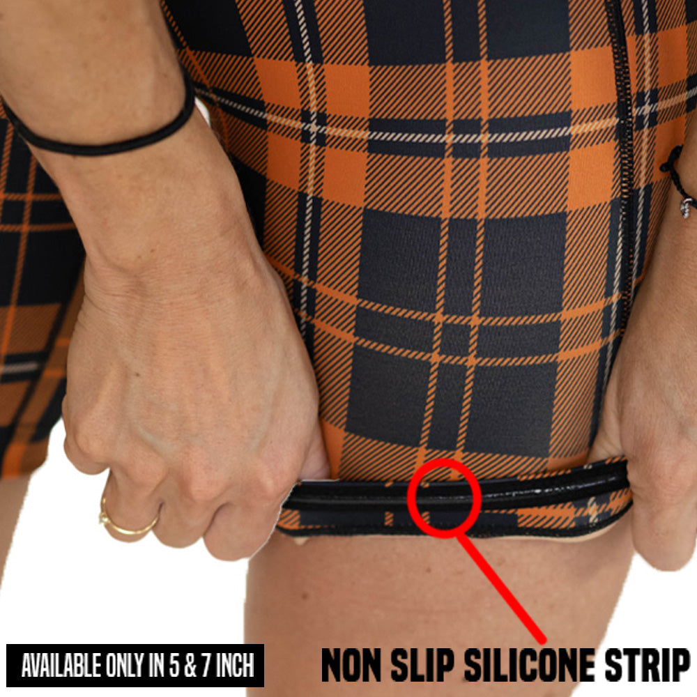 model wearing plaid shorts with a non-slip silicone strip highlighted
