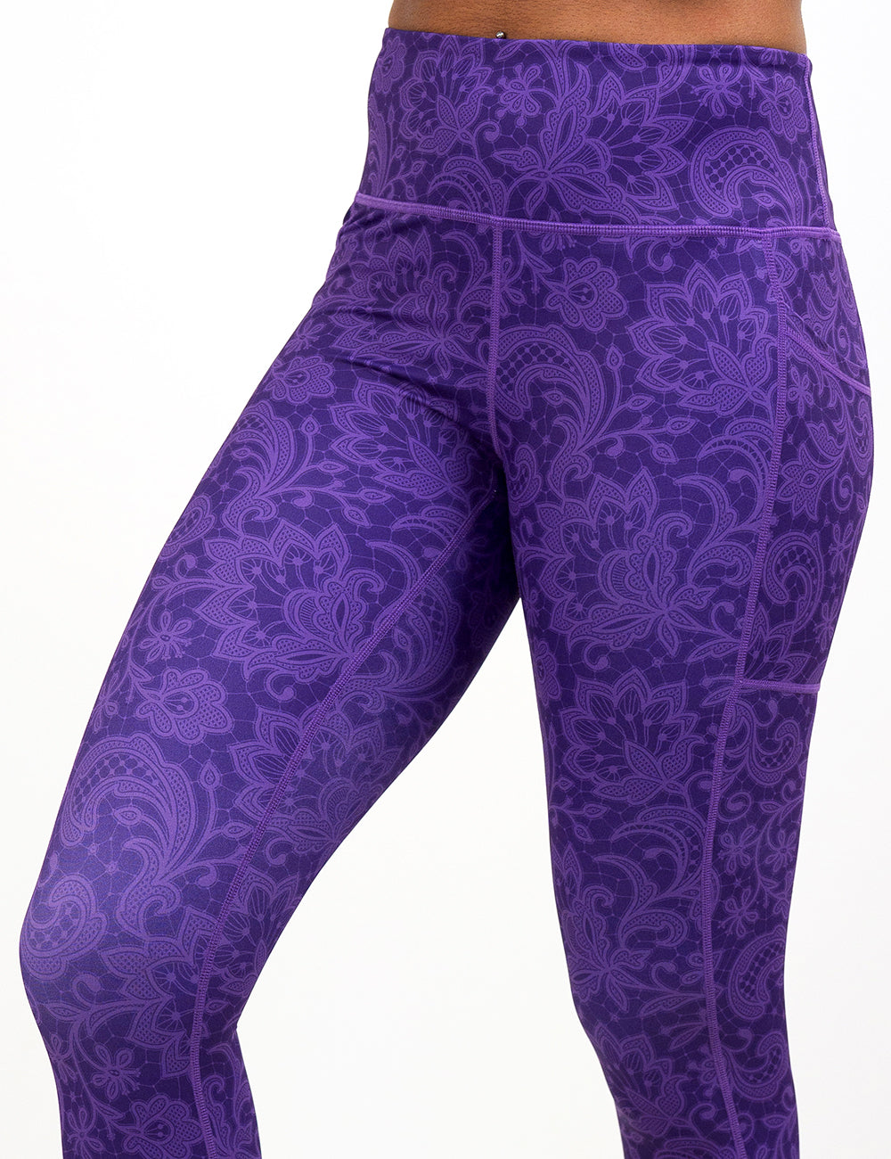purple paisley leggings up close facing the front against a white background