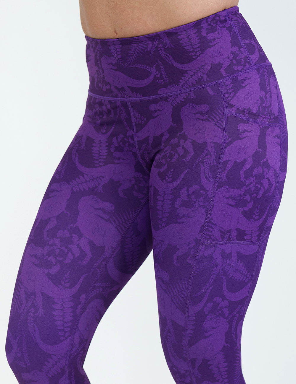 purple dinosaur patterned leggings