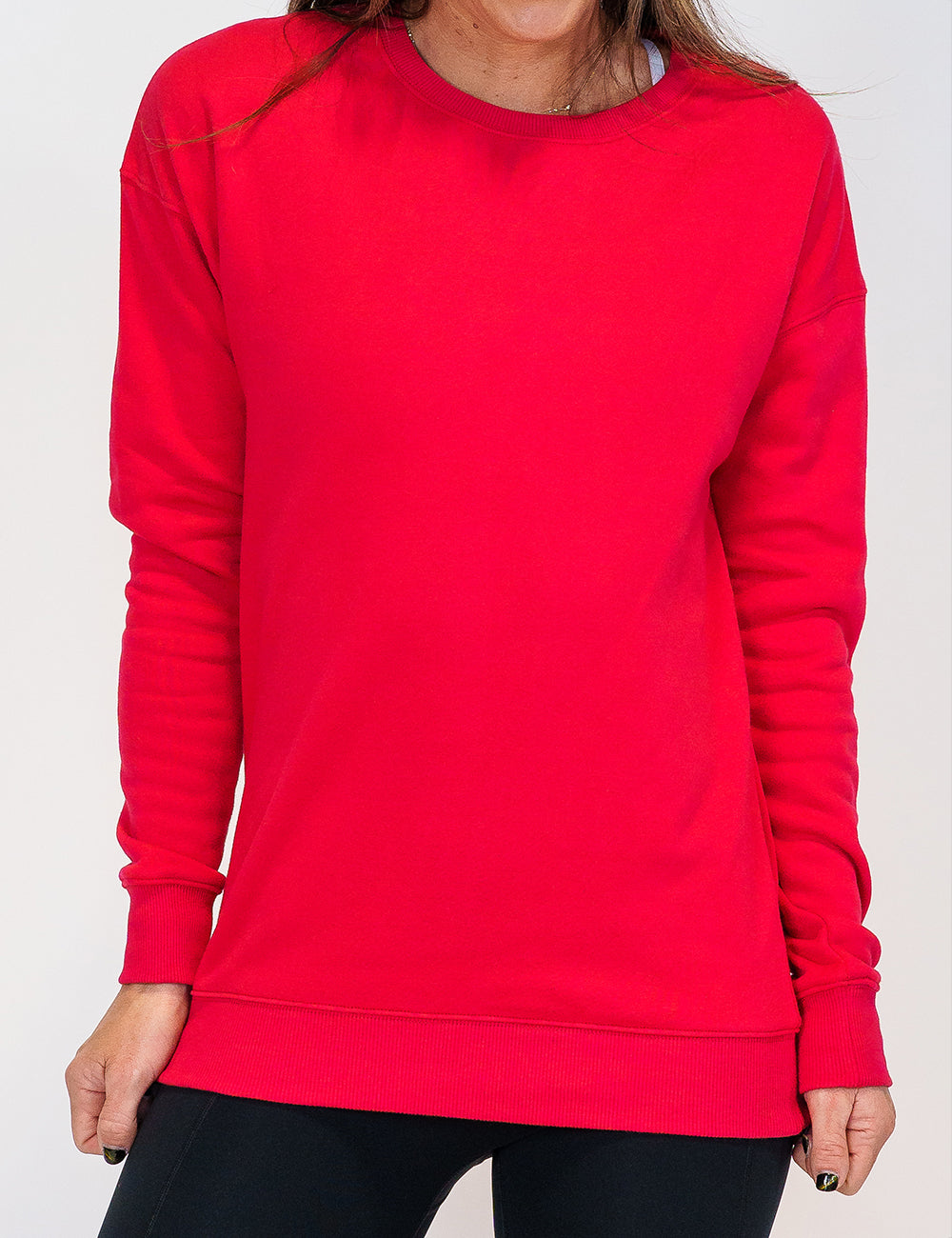 front of the solid red crew neck against a white background