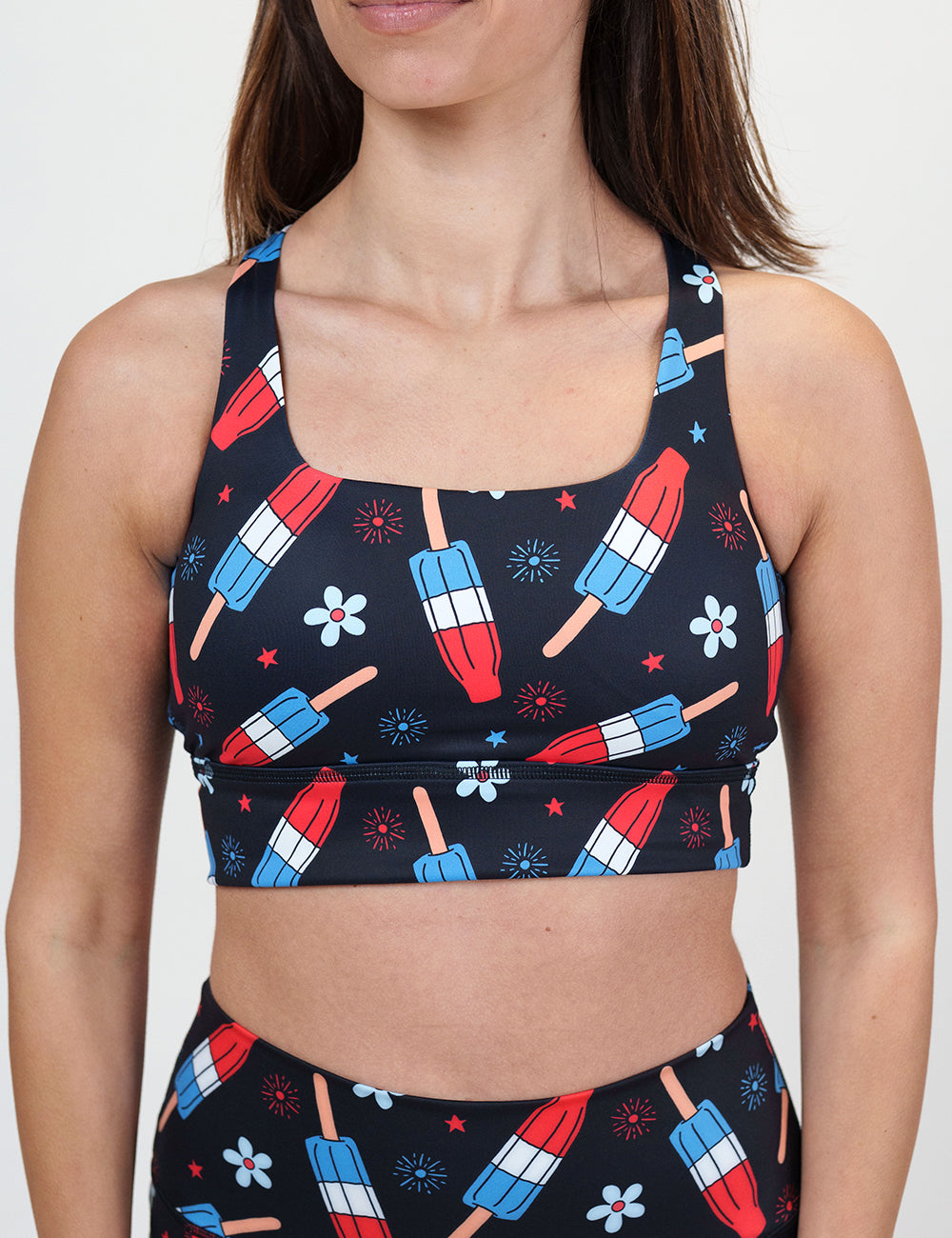 front of the black bra with fireworks, flowers, and patriotic popsicles against a white background
