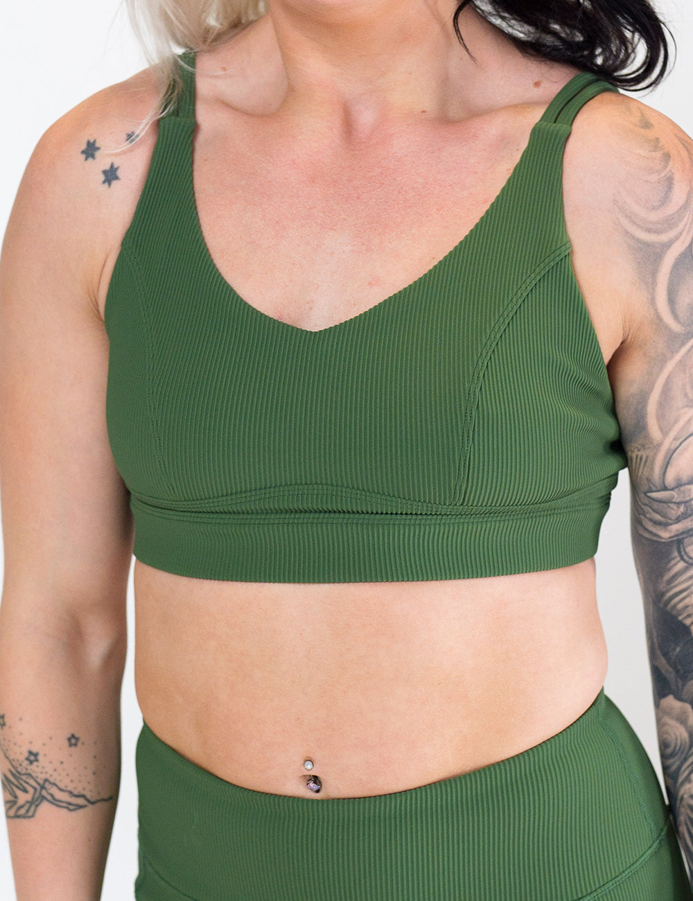 front of the green ribbed sports bra