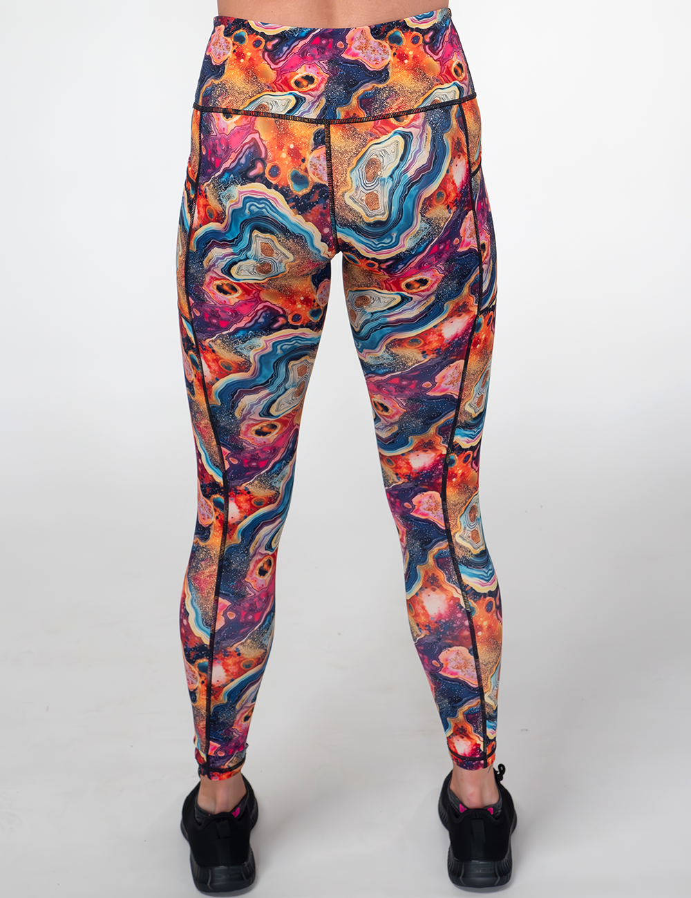 back of the colorful marble patterned leggings against a white background
