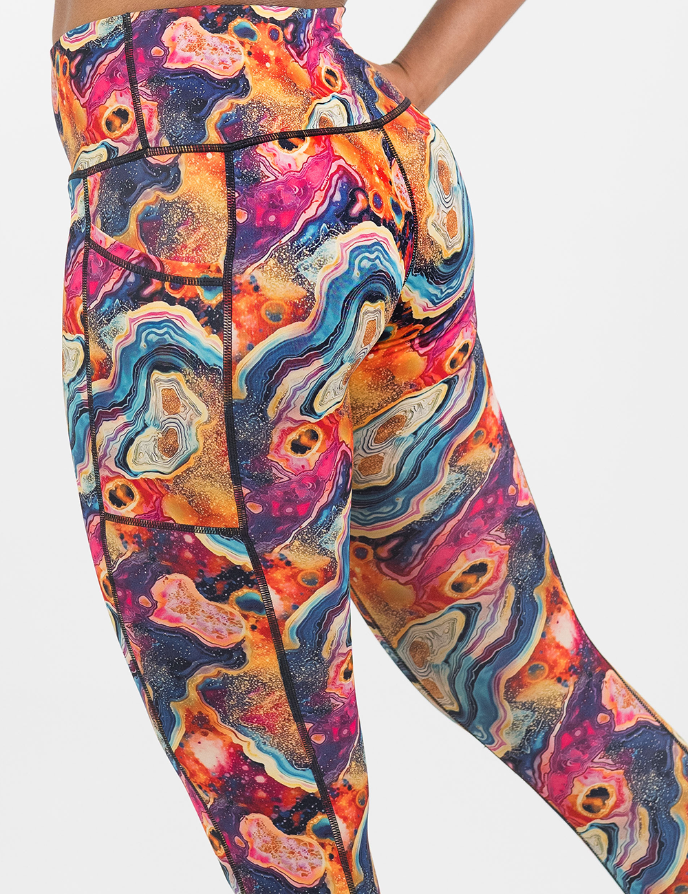 close up of the back of the colorful marble patterned leggings against a white background