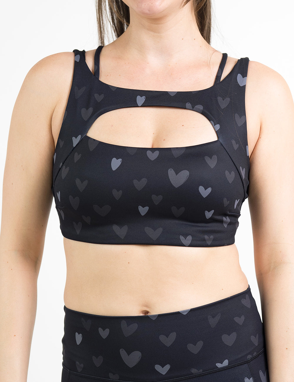 front of the black vista bra with a light and dark grey heart pattern against a white background