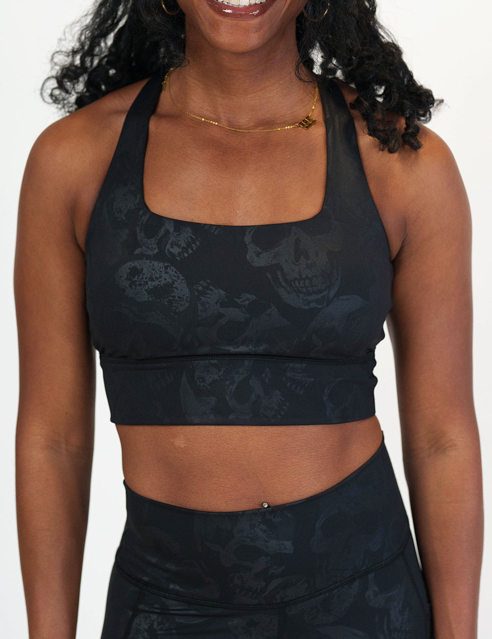 front of the black longline bra with a dark grey skull pattern against a white background