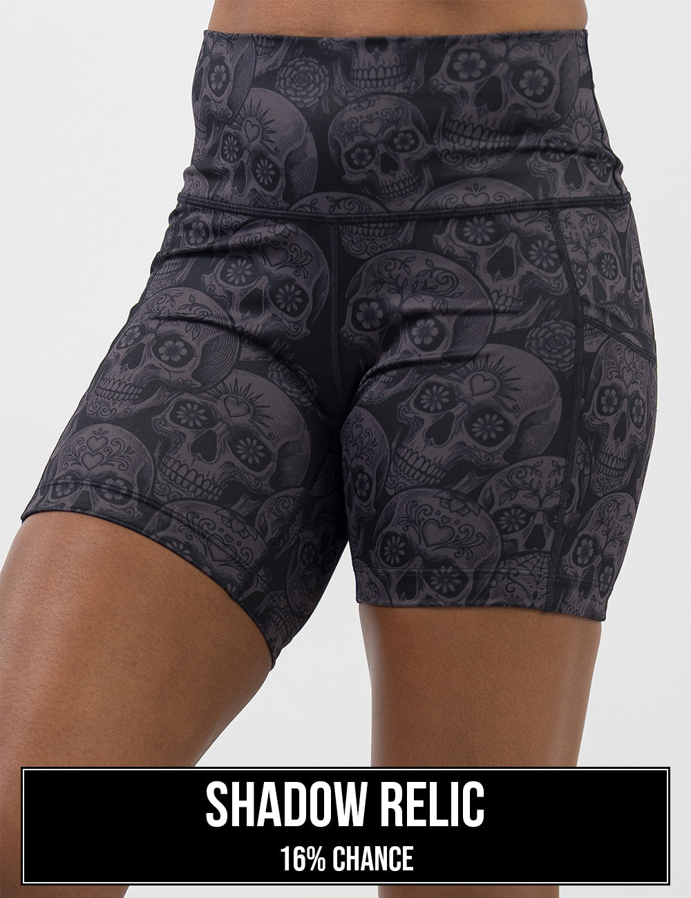 front of the dark grey calavera skulls against a black background 5 inch shorts, the name of this print is shadow relic and it has a 16% chance of being unboxed