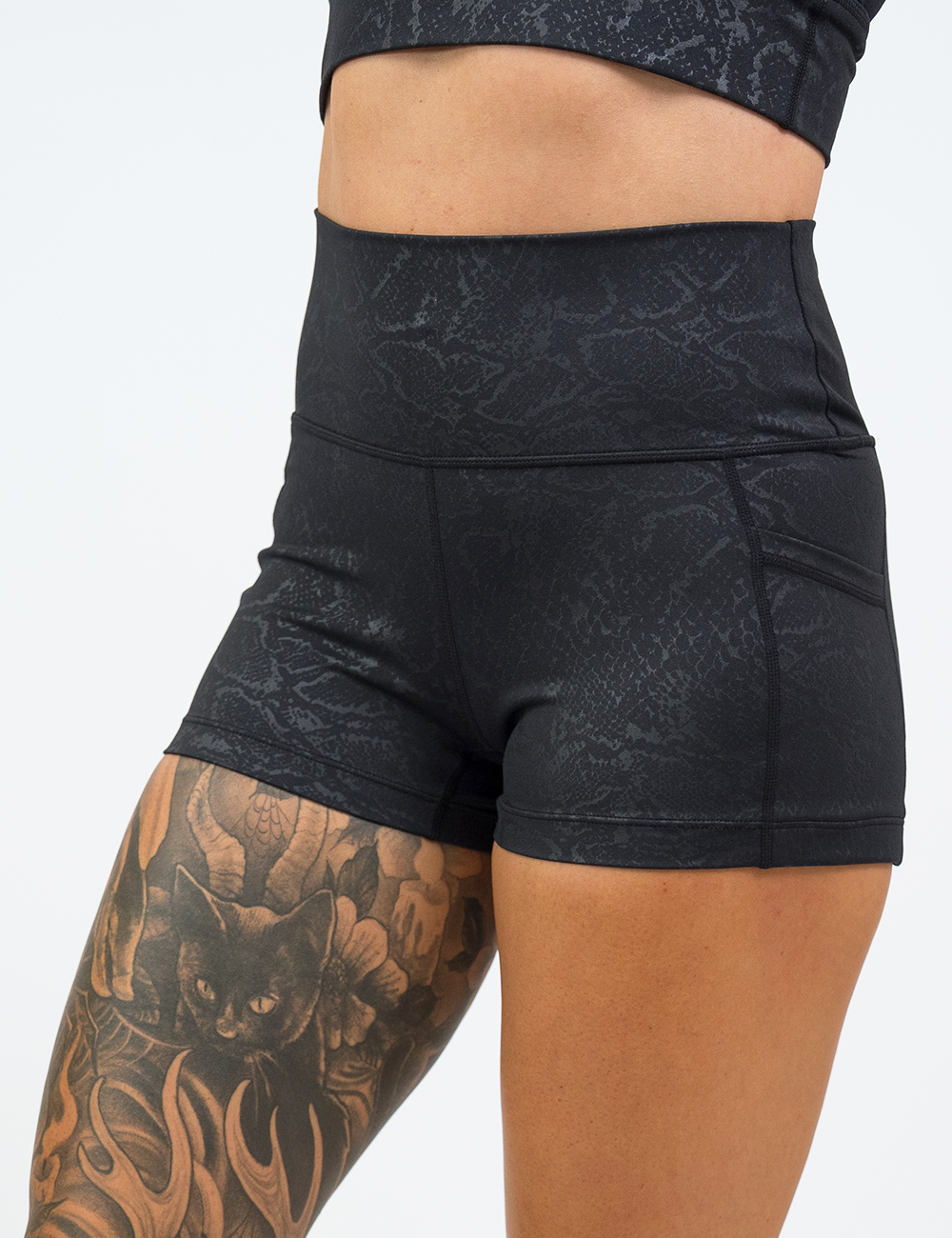 front of the 2.5 inch dark python print shorts against a white background