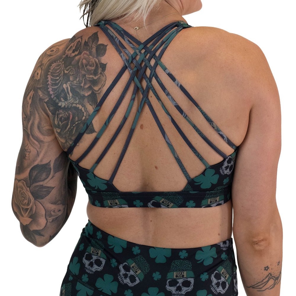 back of the skull and shamrock print sports bra