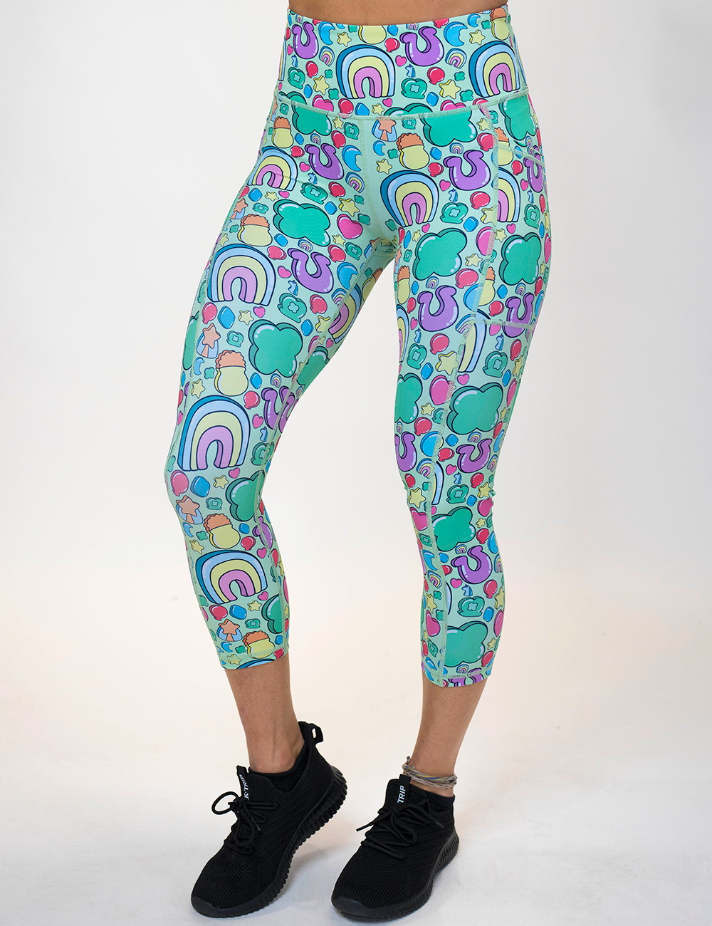 model wearing the St Patrick's day inspired charms print capri leggings against a white background