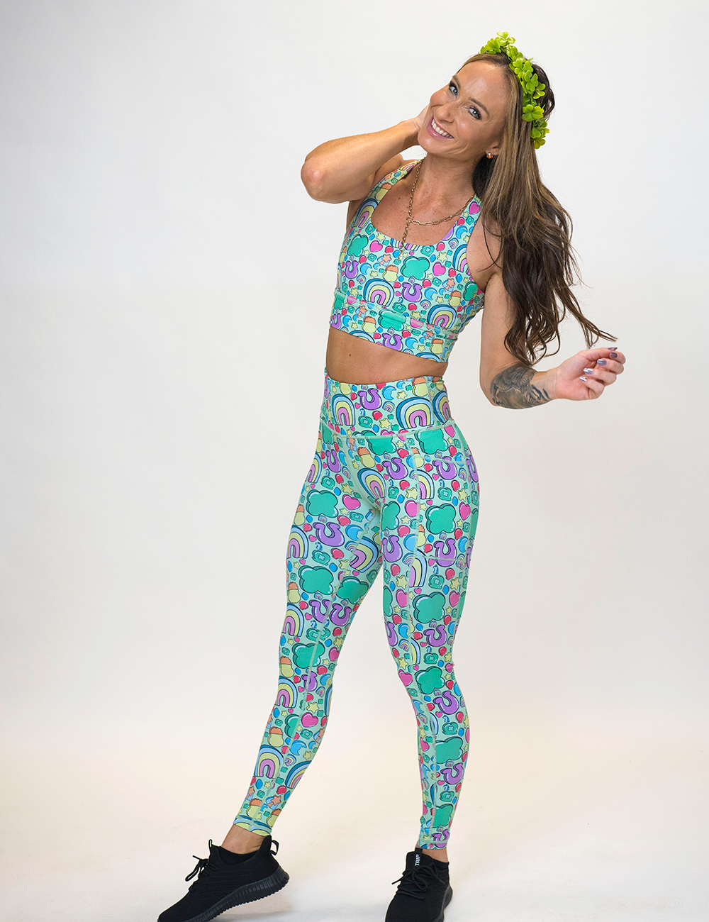 model wearing the St Patrick's day inspired charms print full length leggings against a white background
