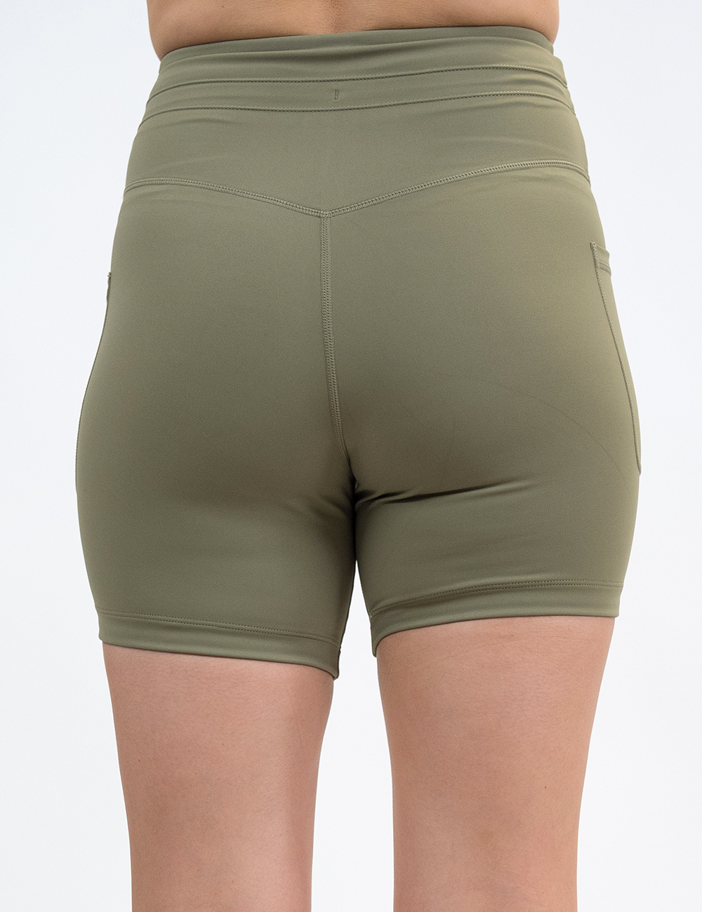 back of the 5 inch omni solid green shorts against a white background