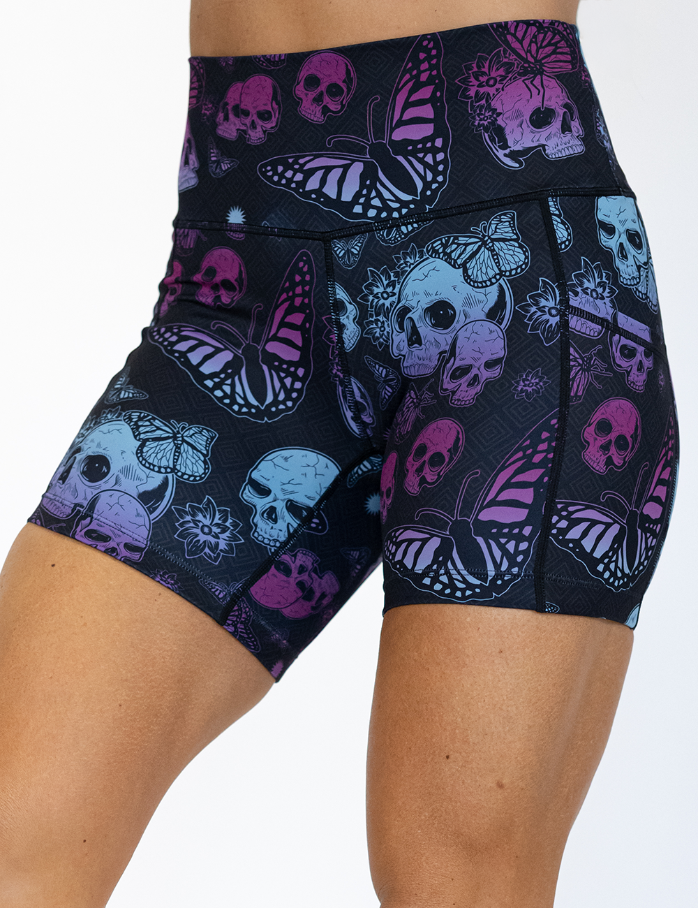 5 inch blue and purple skulls surrounded by butterflies shorts facing the front against a white background