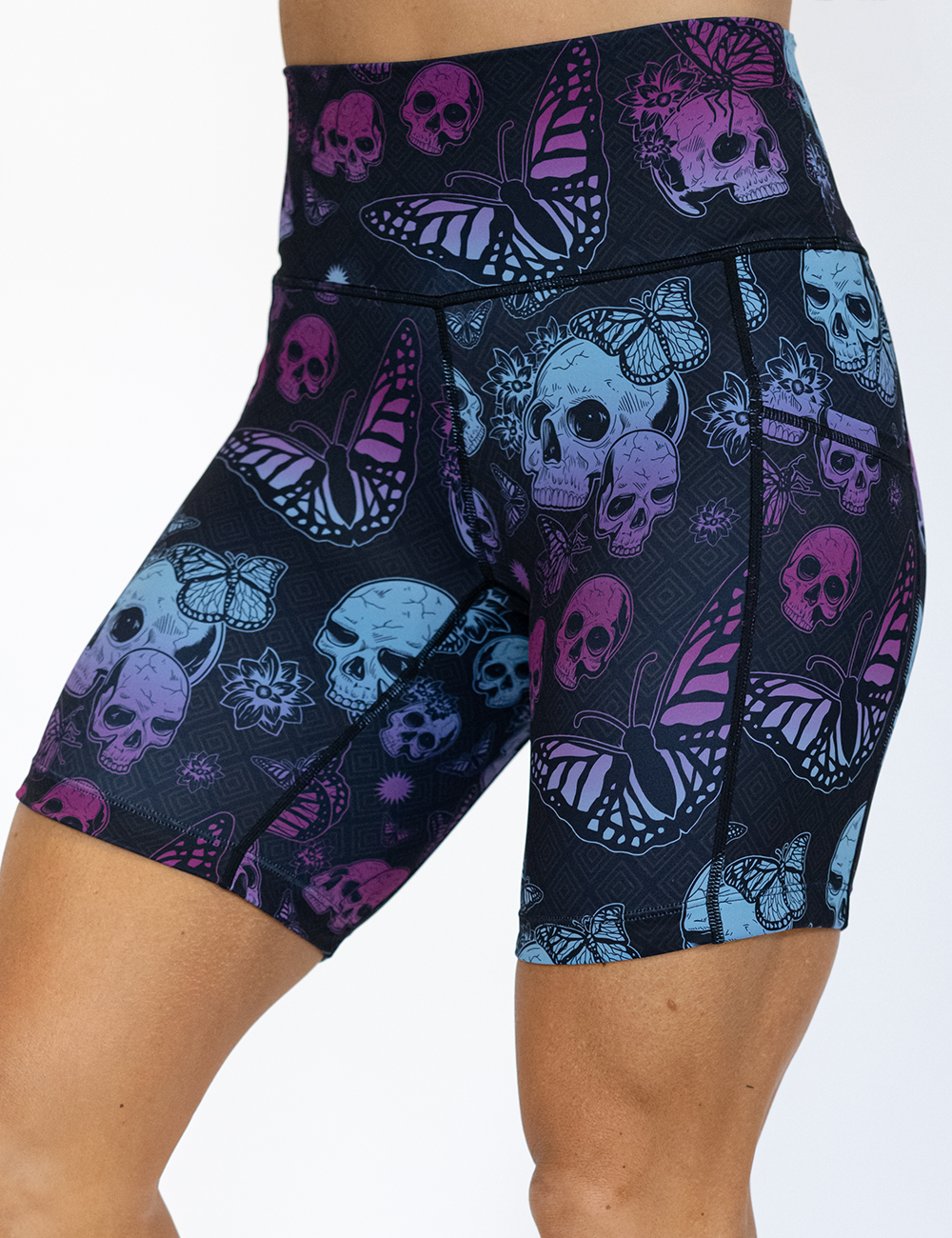 7 inch blue and purple skulls surrounded by butterflies shorts facing the front against a white background