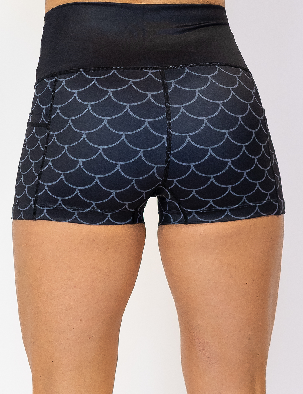 back of the dragon scale outline against a dark background pattern 2.5 inch shorts against a white background