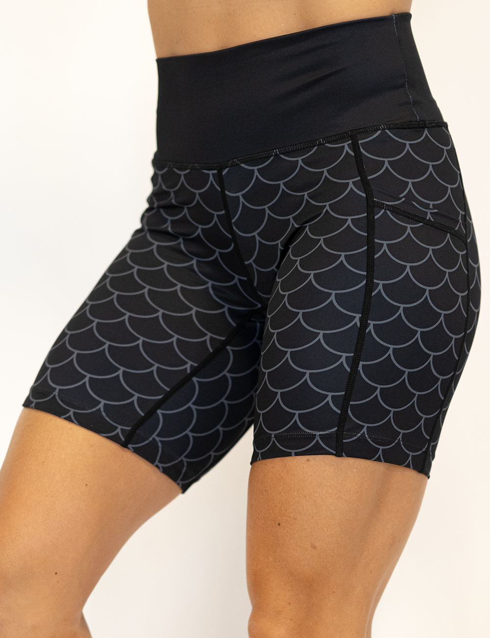 dragon scale outline against a dark background pattern 7 inch shorts facing the front against a white background