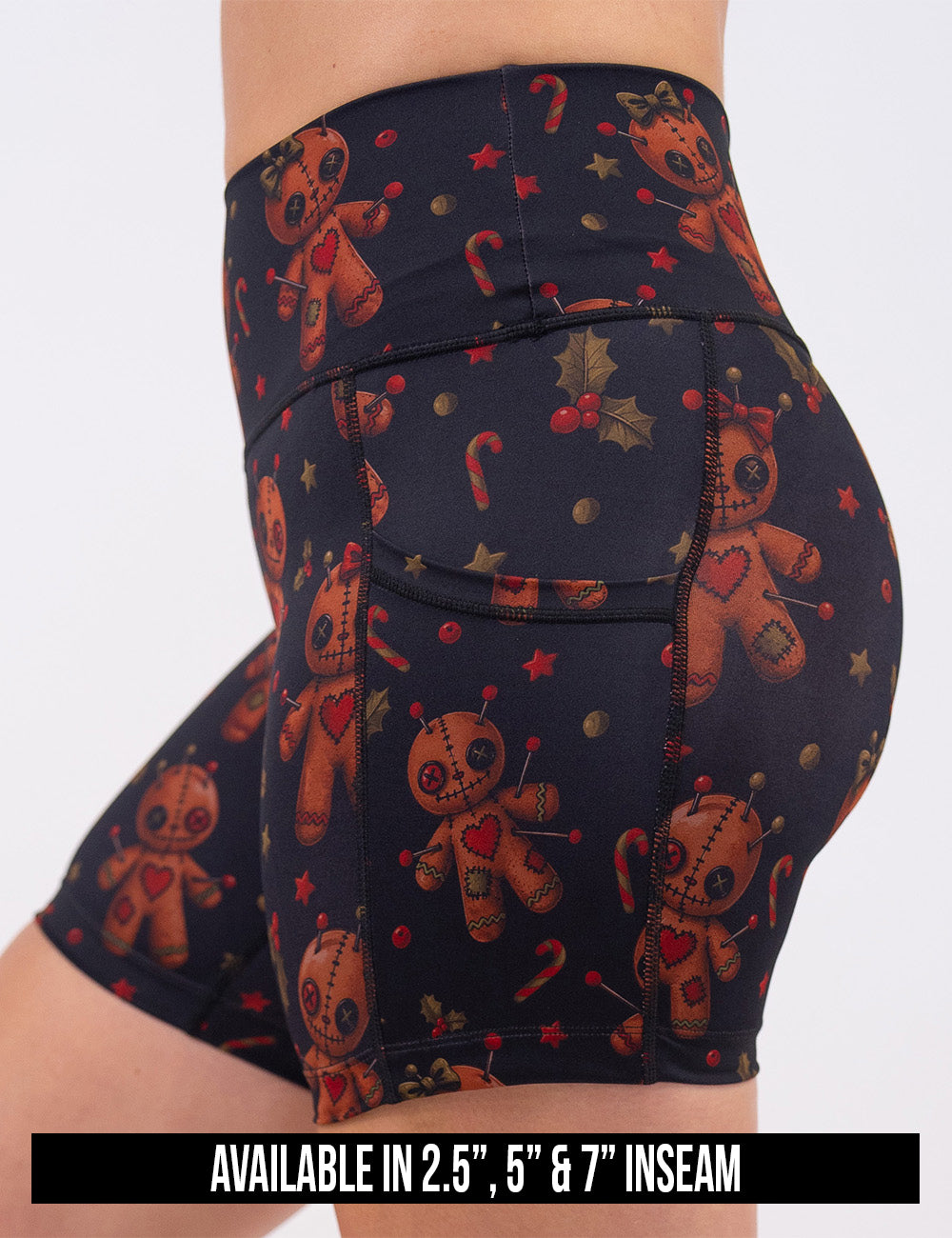 available inseam lengths for the gingerbread voodoo dolls with pins in them surrounded by berries and stars on a black background shorts