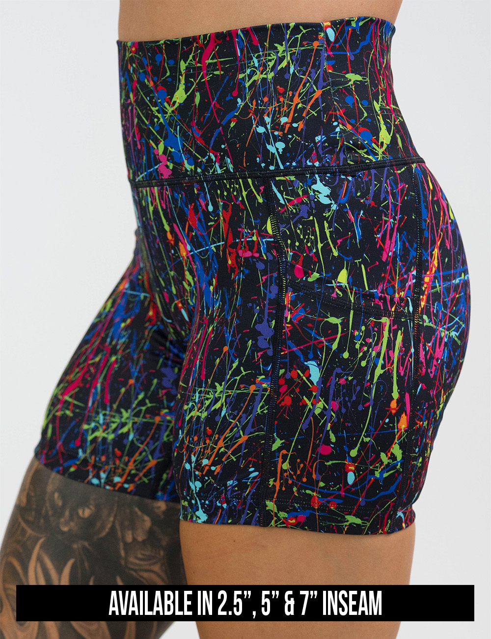 available inseam lengths for the rainbow paint splatter against a black background shorts, lengths include 2.5 inches, 5 inches, and 7 inches