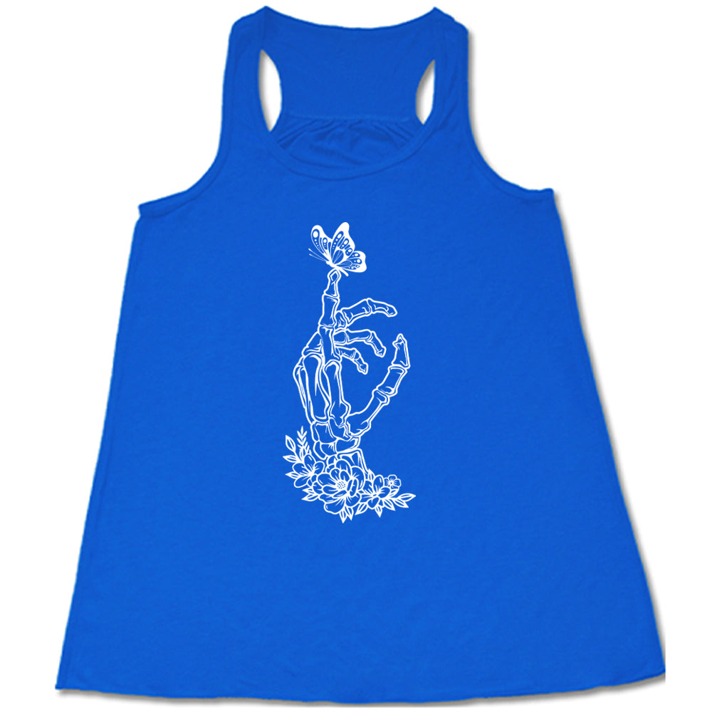 Blue colored flowy tank with a butterfly on a skeletons hand graphic on it