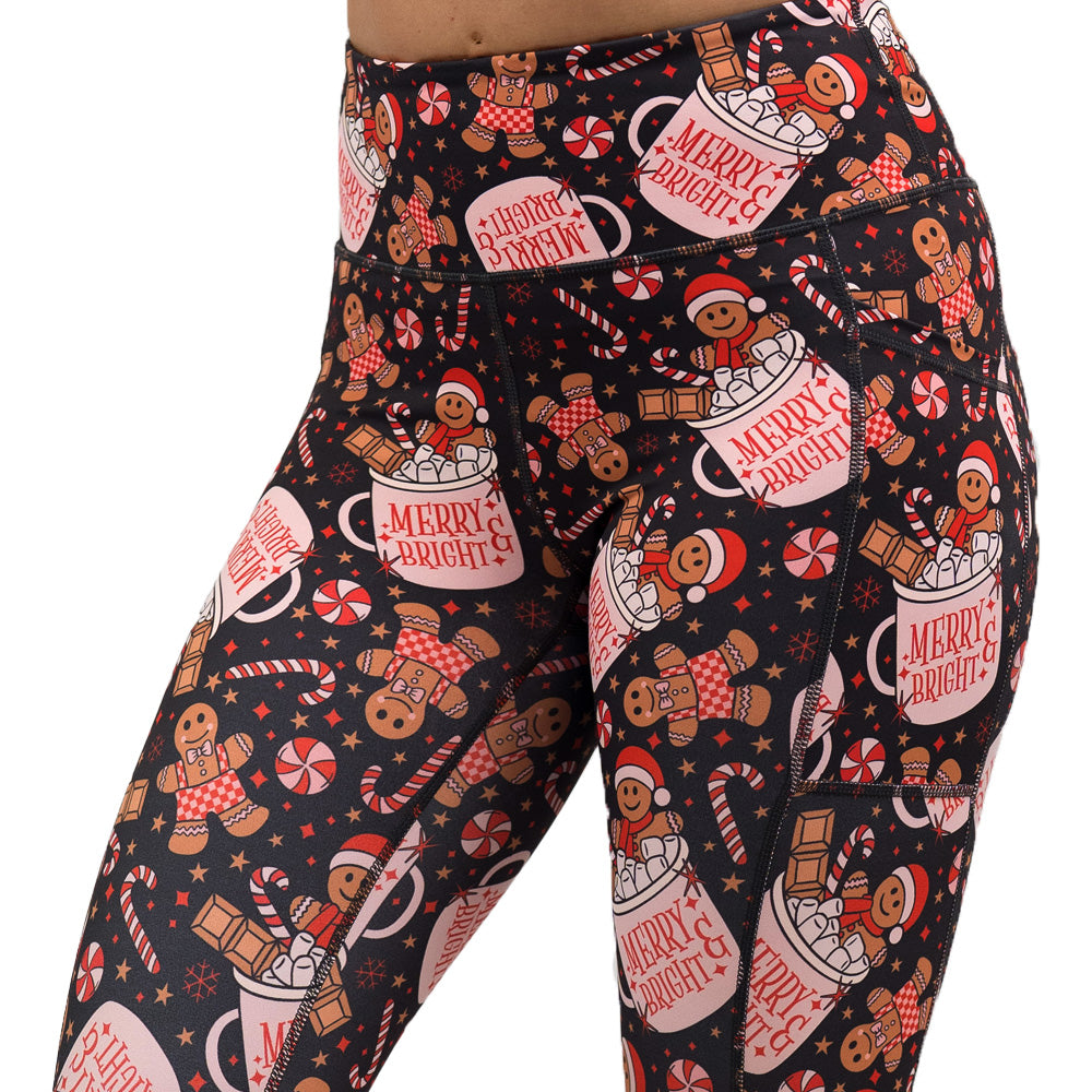 Christmas-themed leggings with gingerbread men and candy canes