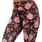 Christmas-themed leggings with gingerbread men and candy canes