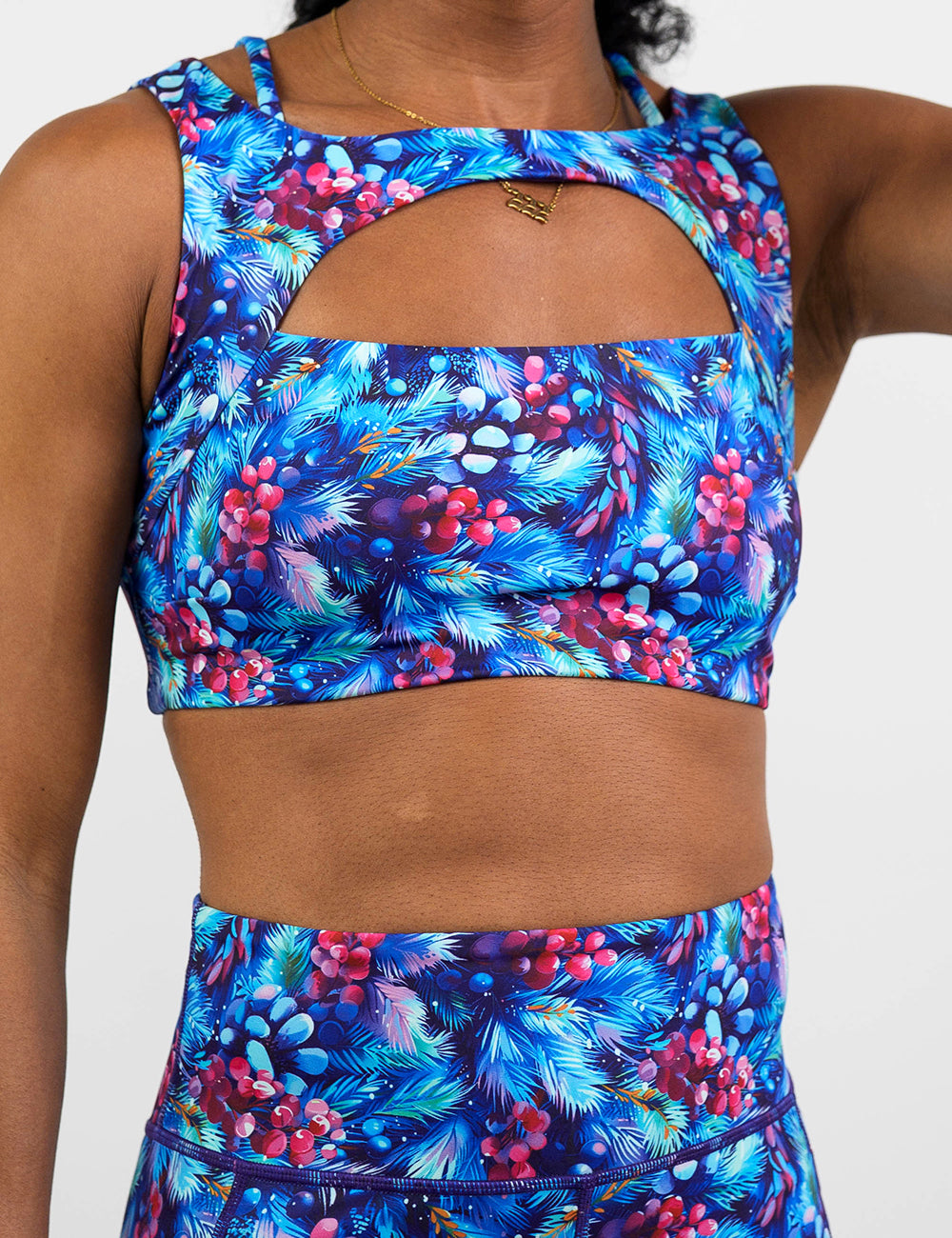 front of the winter berries among blue leaves sports bra