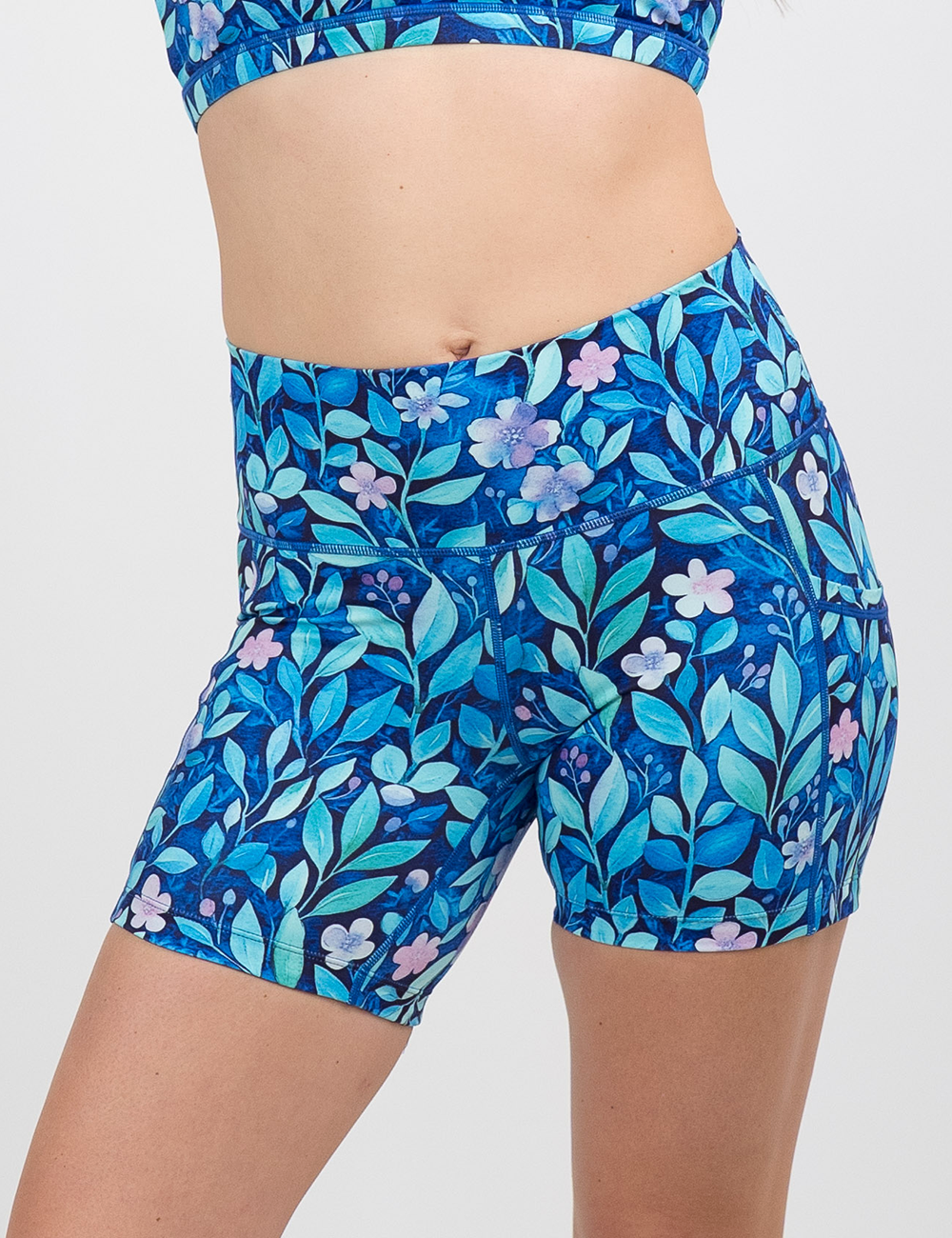 close up of the 5 inch blue flowers and vines shorts against a white background facing the front
