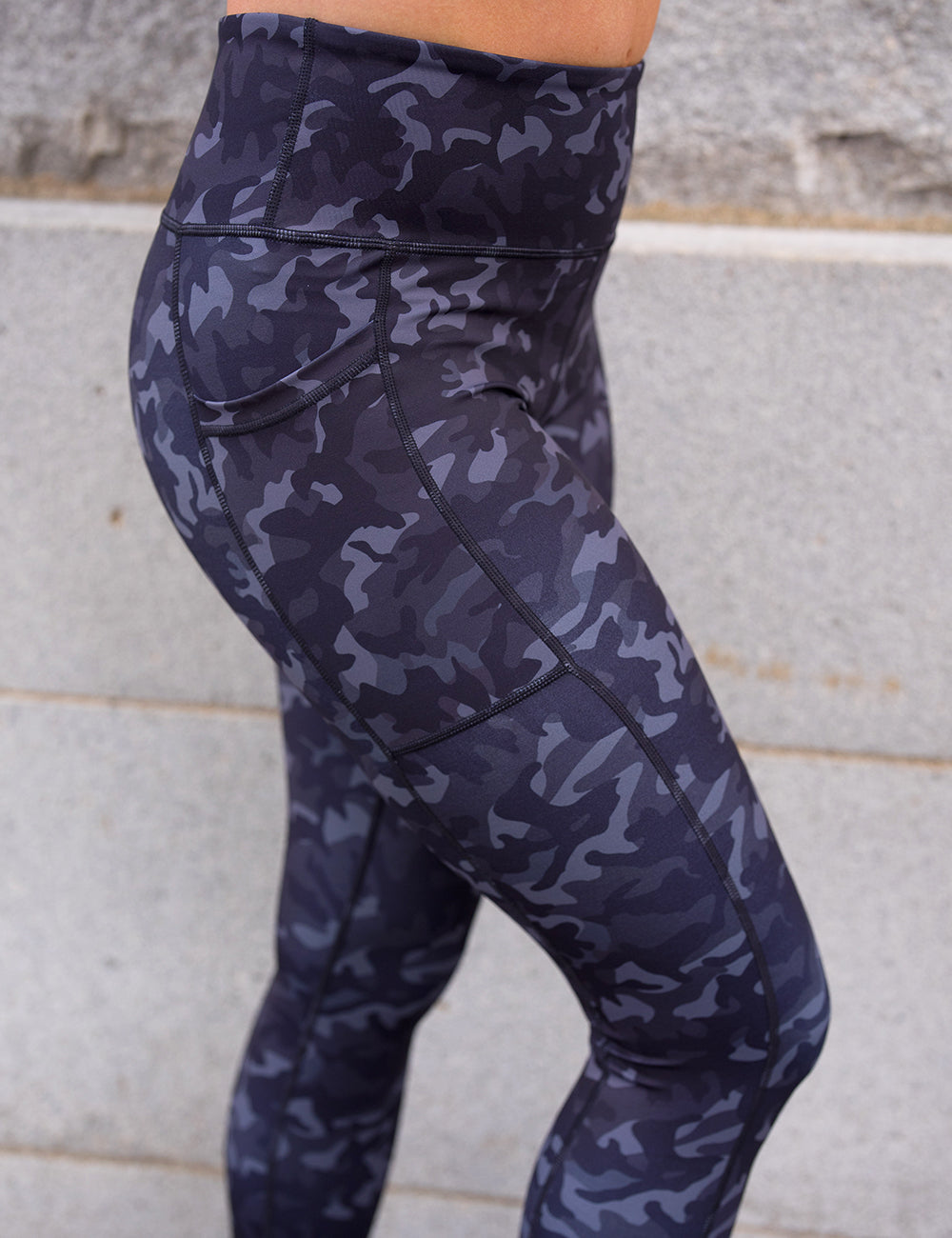 model wearing the black camo print leggings