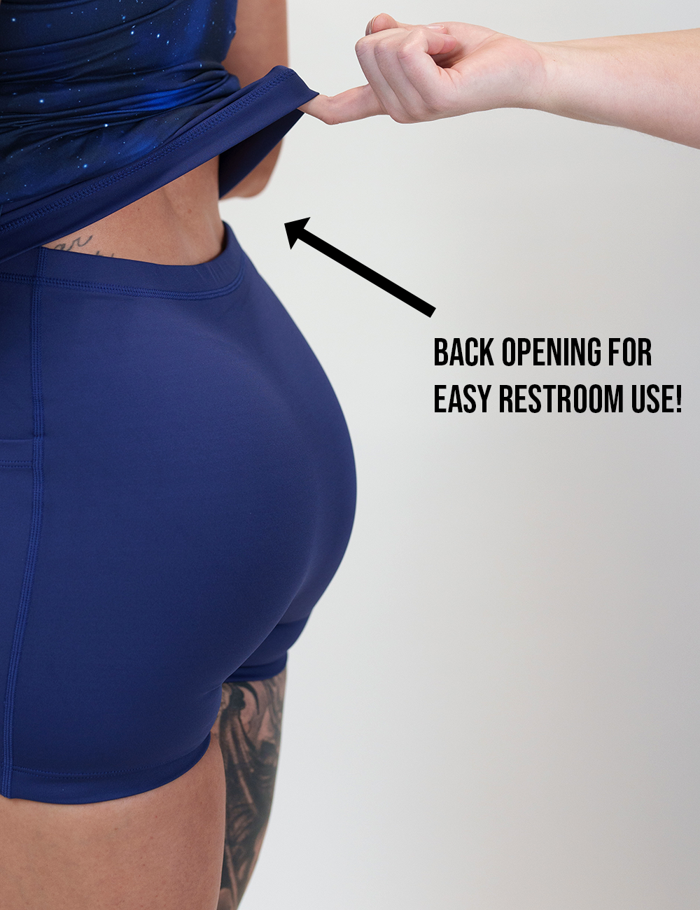 close up of the galaxy dress being lifted up to show the back opening for easy restroom use