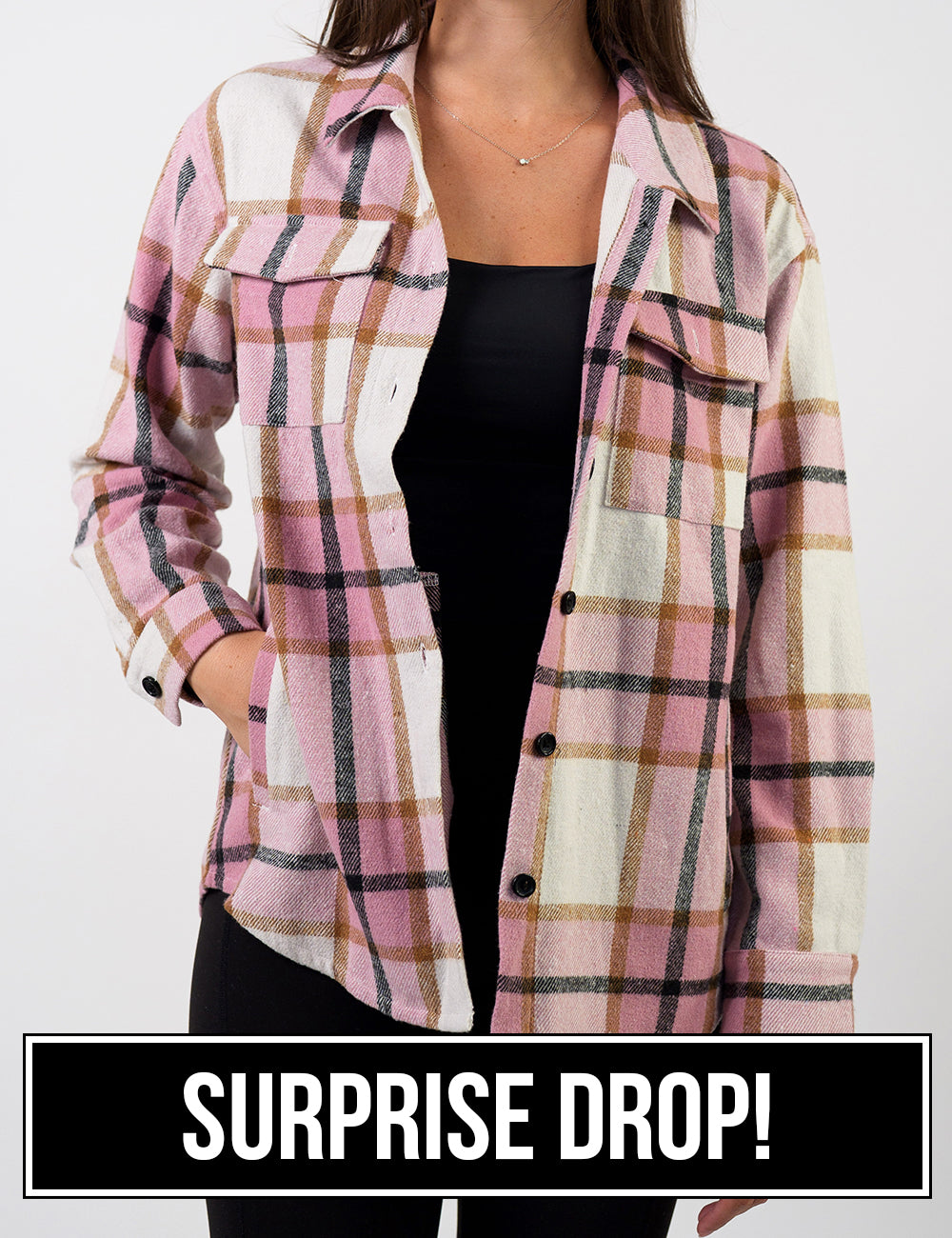 front of the pink, black, white, and brown plaid shacket, surprise drop