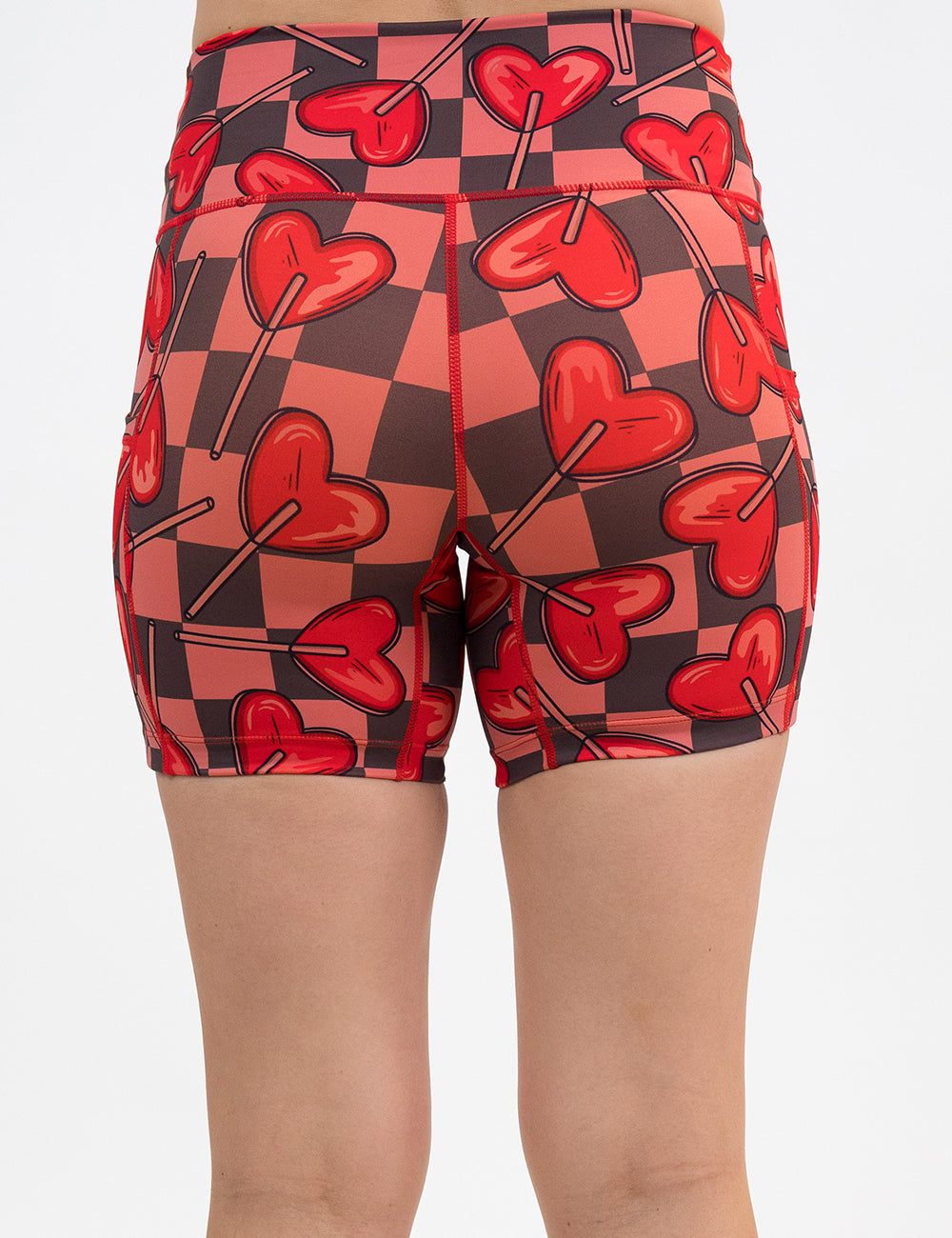 back of the 5 inch heart lollypops on a checker board pattern shorts against a white background