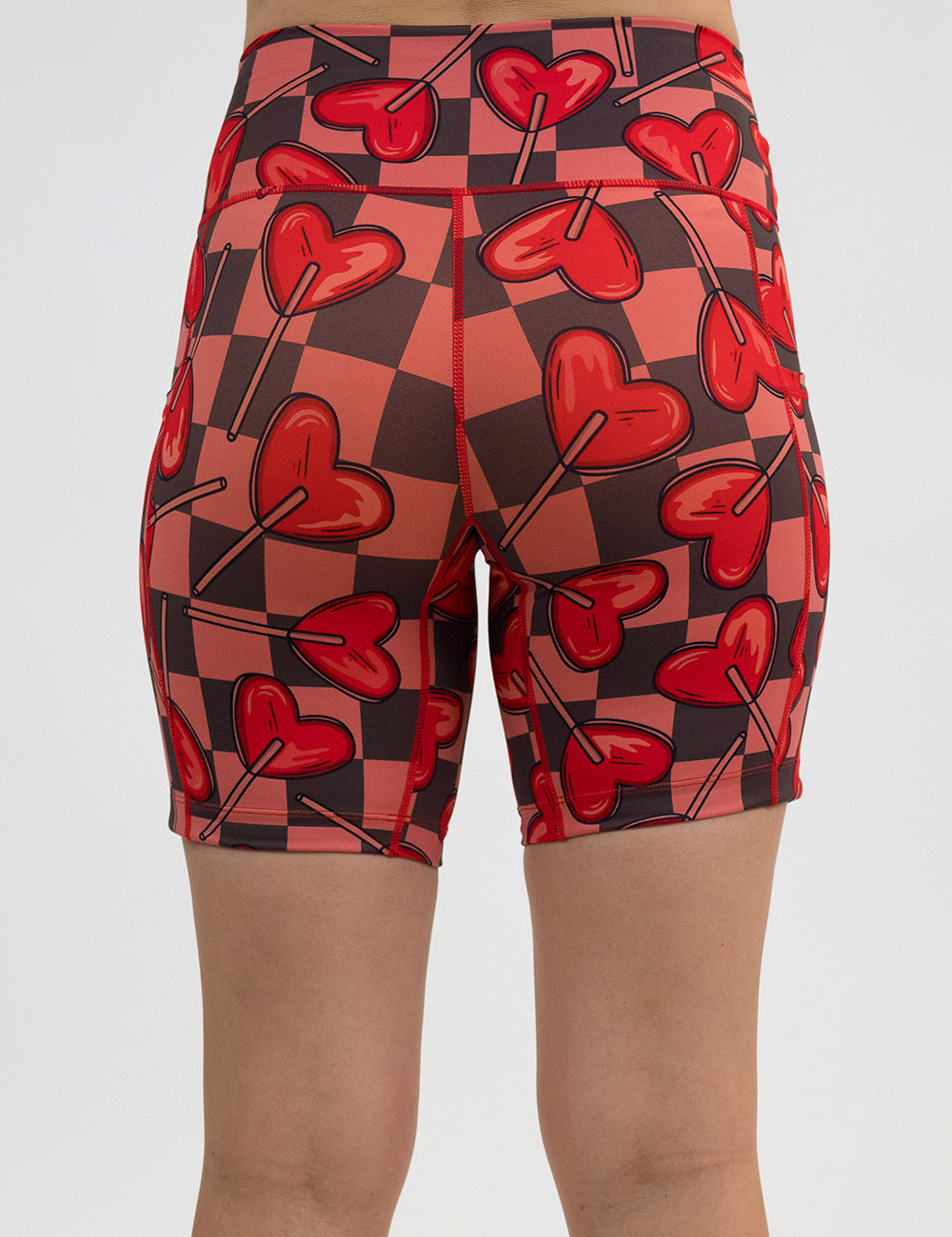 back of the 7 inch heart lollypops on a checker board pattern shorts against a white background