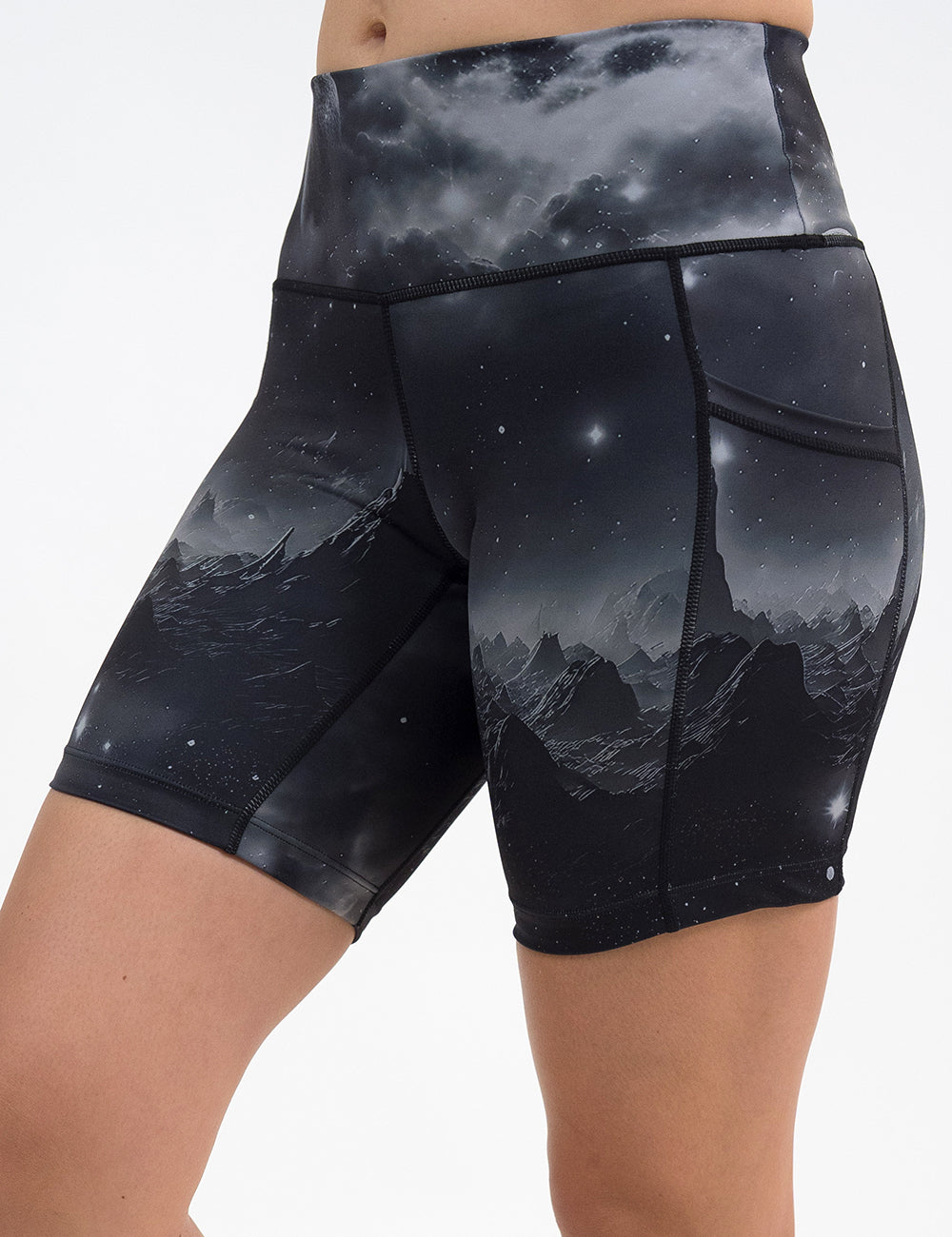 front of the dark mountains in space 7 inch shorts against a white background
