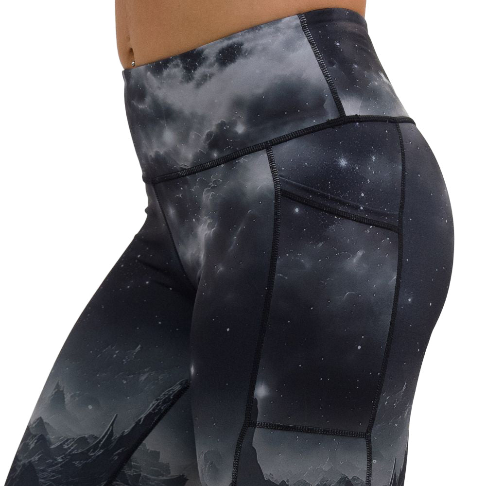 close up of black leggings with mountain and star pattern against a white background