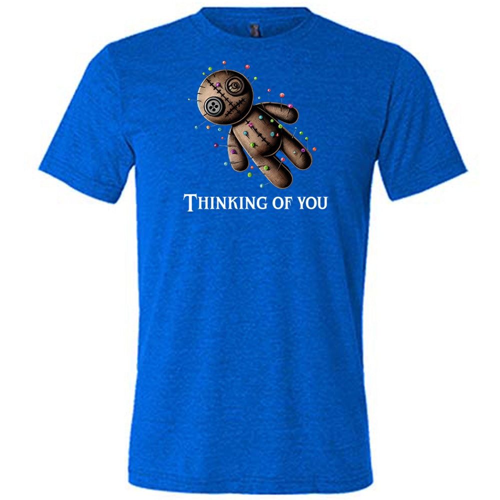 blue shirt with the quote "Thinking Of You" on it