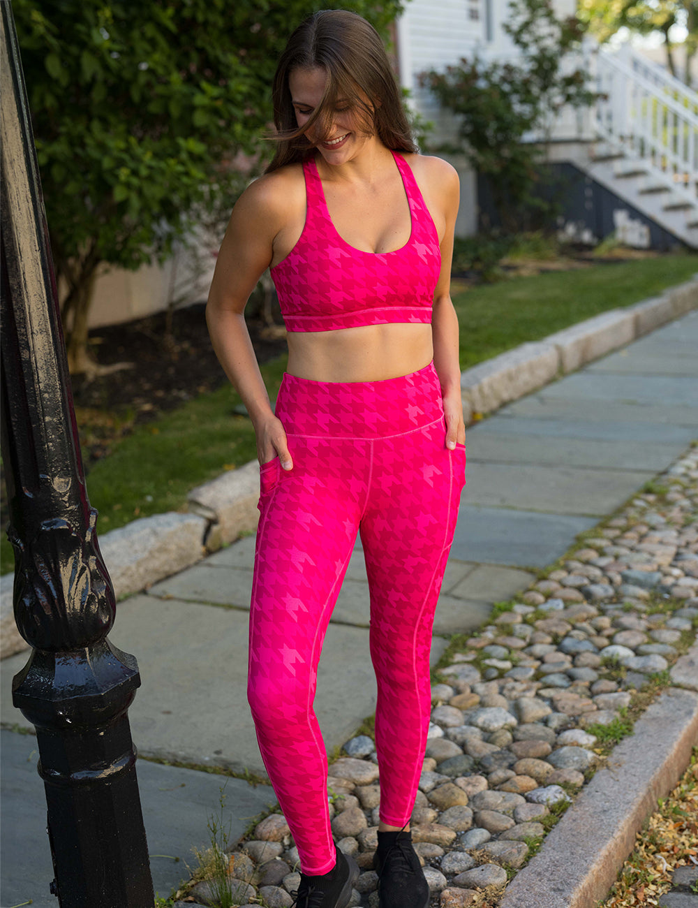 model wearing the pink houndstooth leggings and bra