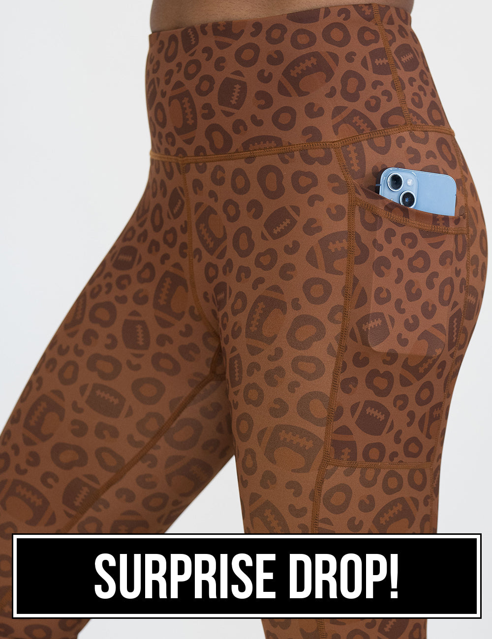 close up of the football themed brown leopard print leggings with a phone in its pocket, surprise drop