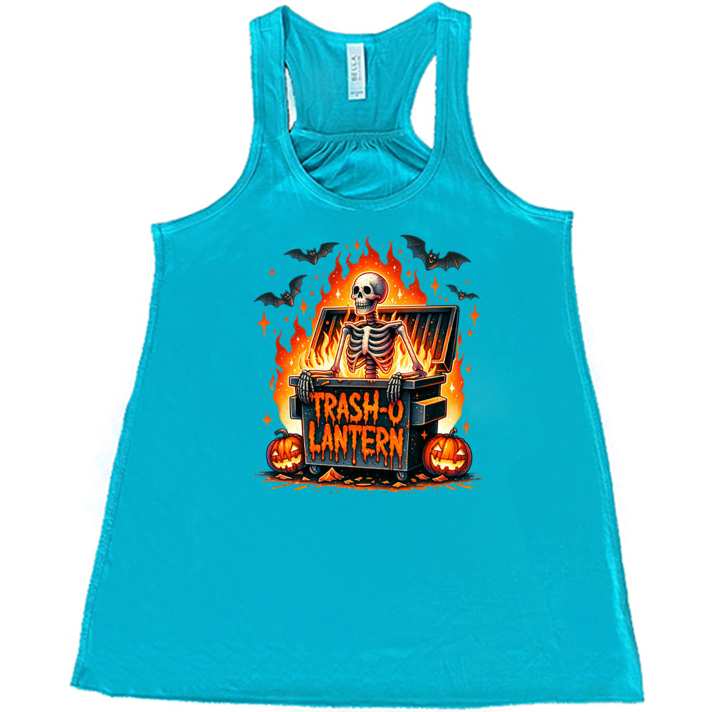 blue shirt with a skeleton graphic and the quote "trash-o lantern" on it