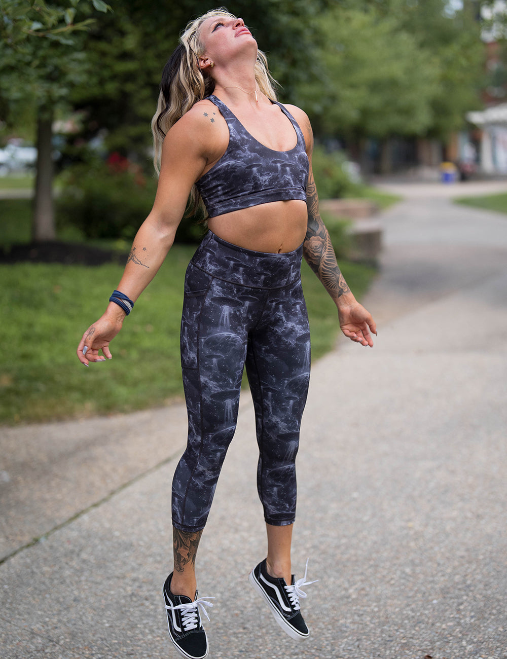 model wearing the alien space ship invasion leggings and sports bra