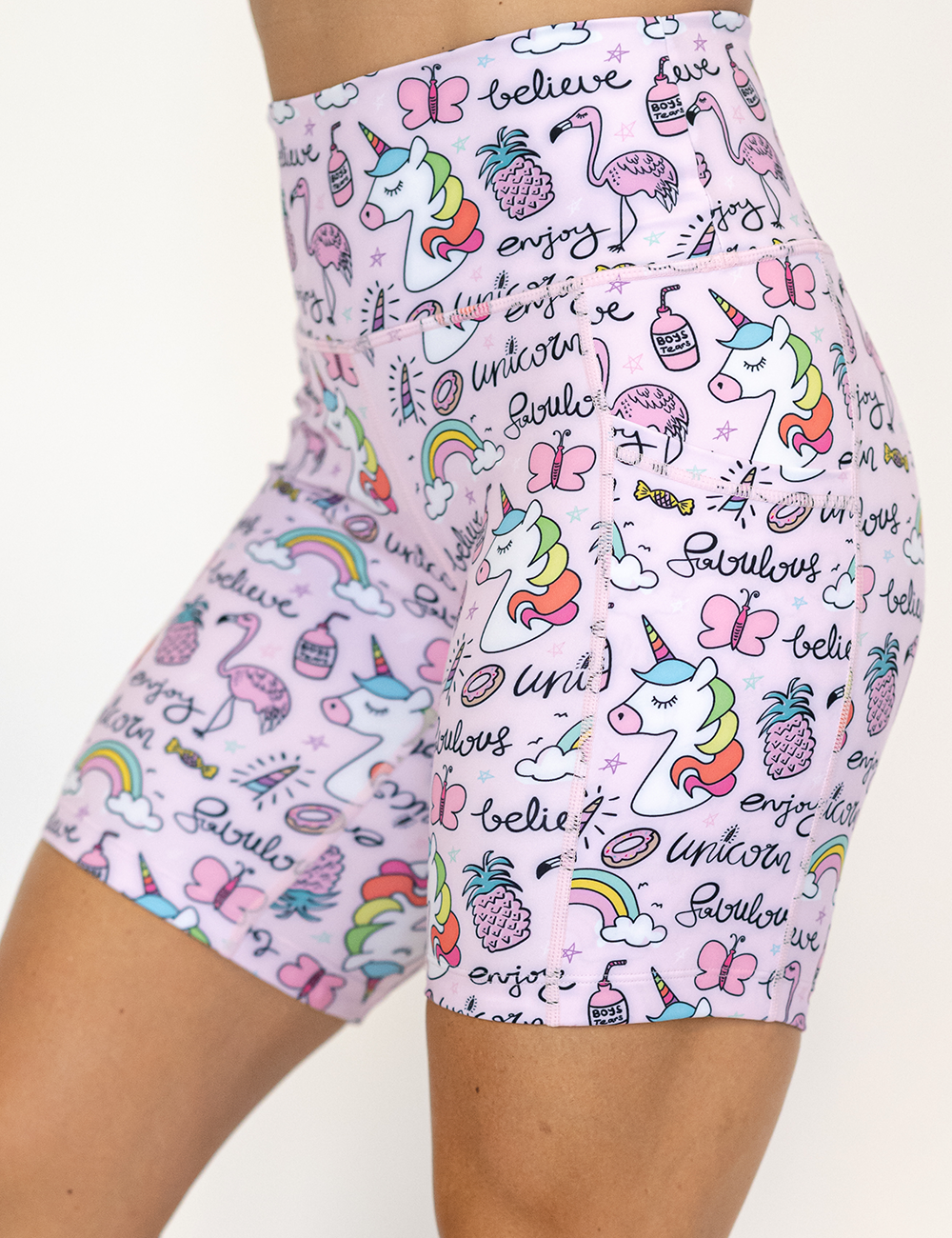 the unicorn and icons pink 7 inch shorts facing the front against a white background