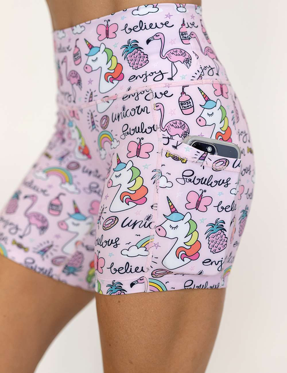 the unicorn and icons pink zoomed in to show a phone in the pocket