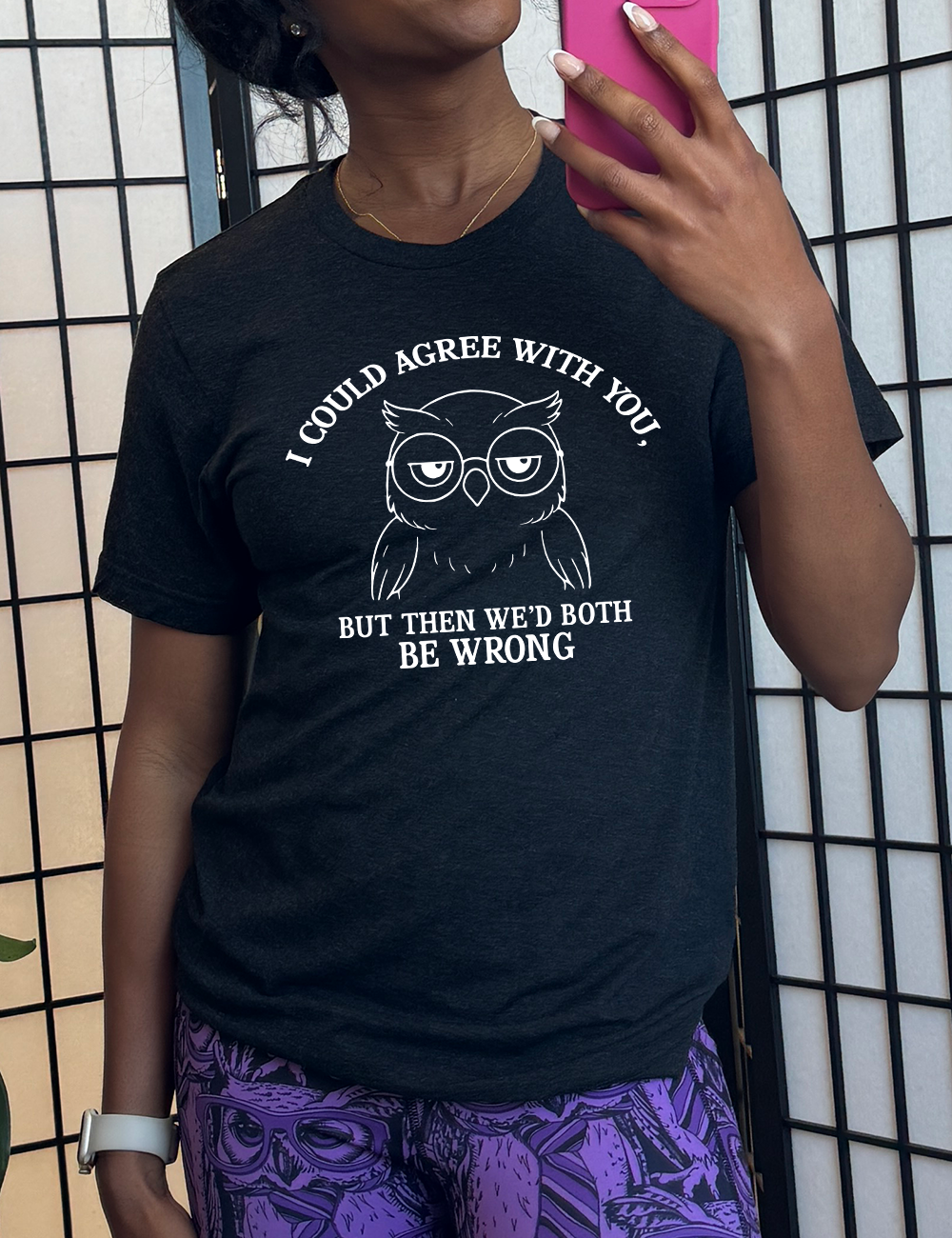 black unisex tee with the graphic of an annoyed-looking bespectacled owl, eyes half-lidded, and the words "I could agree with you, but then we'd both be wrong" written around it