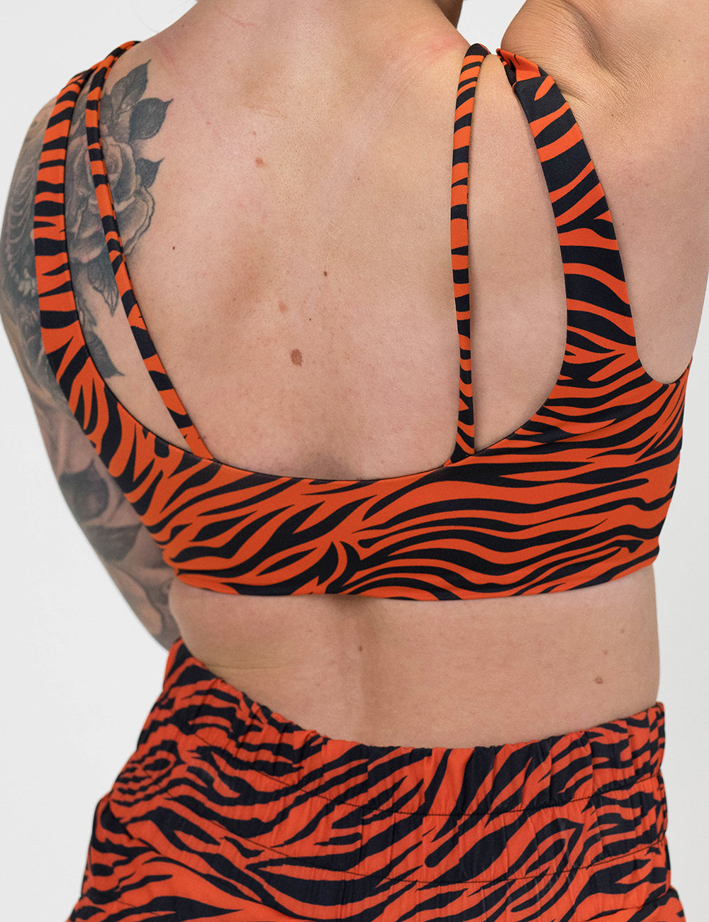 back of the tiger print bra against a white background