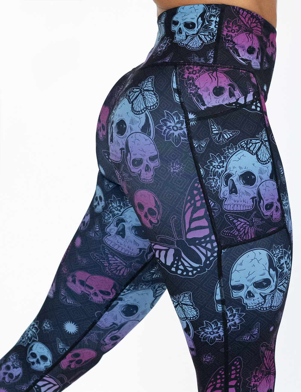 close up of the blue and purple skull surrounded by butterflies leggings facing the front