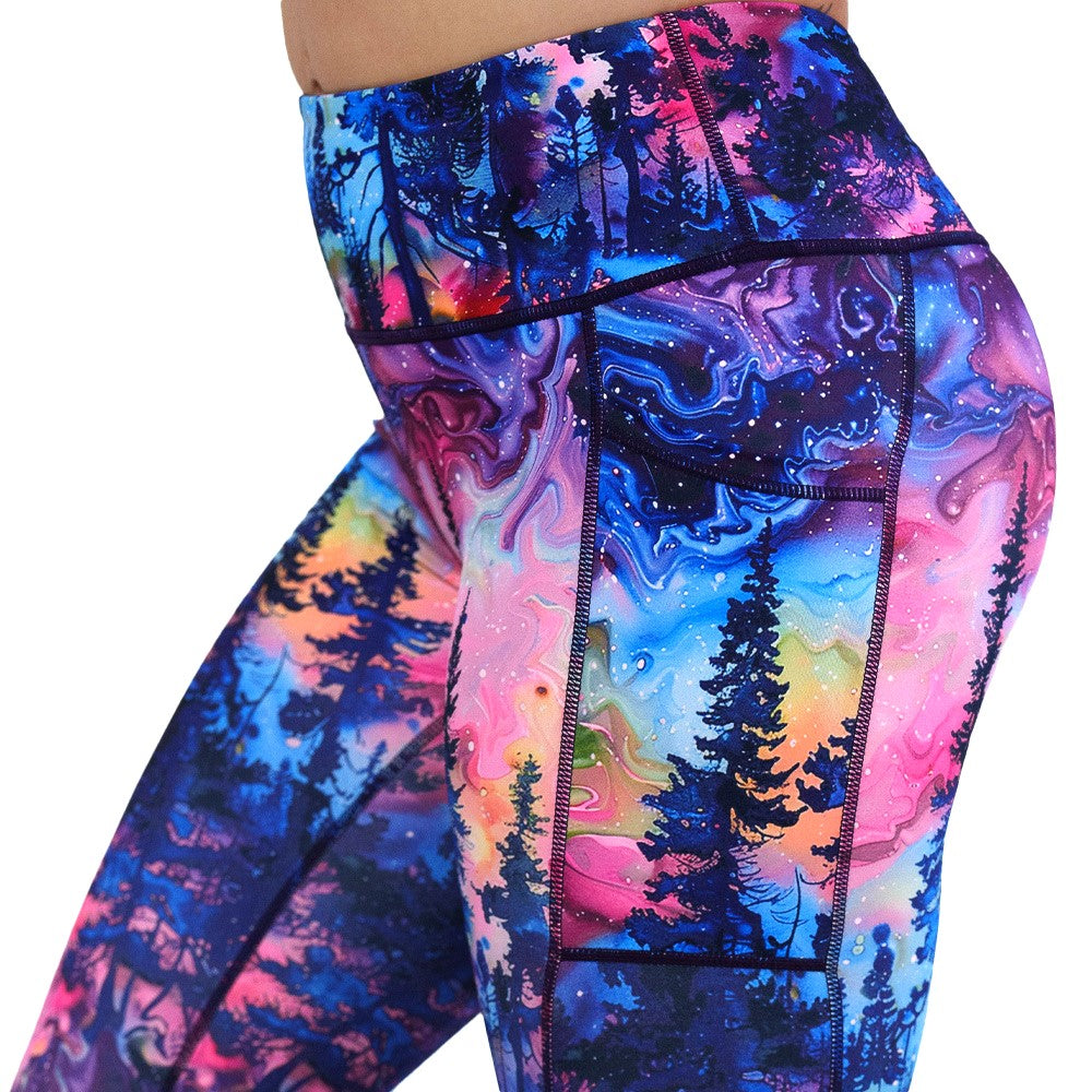 close up of the watercolor rainbow patterned forest leggings facing the front against a white background