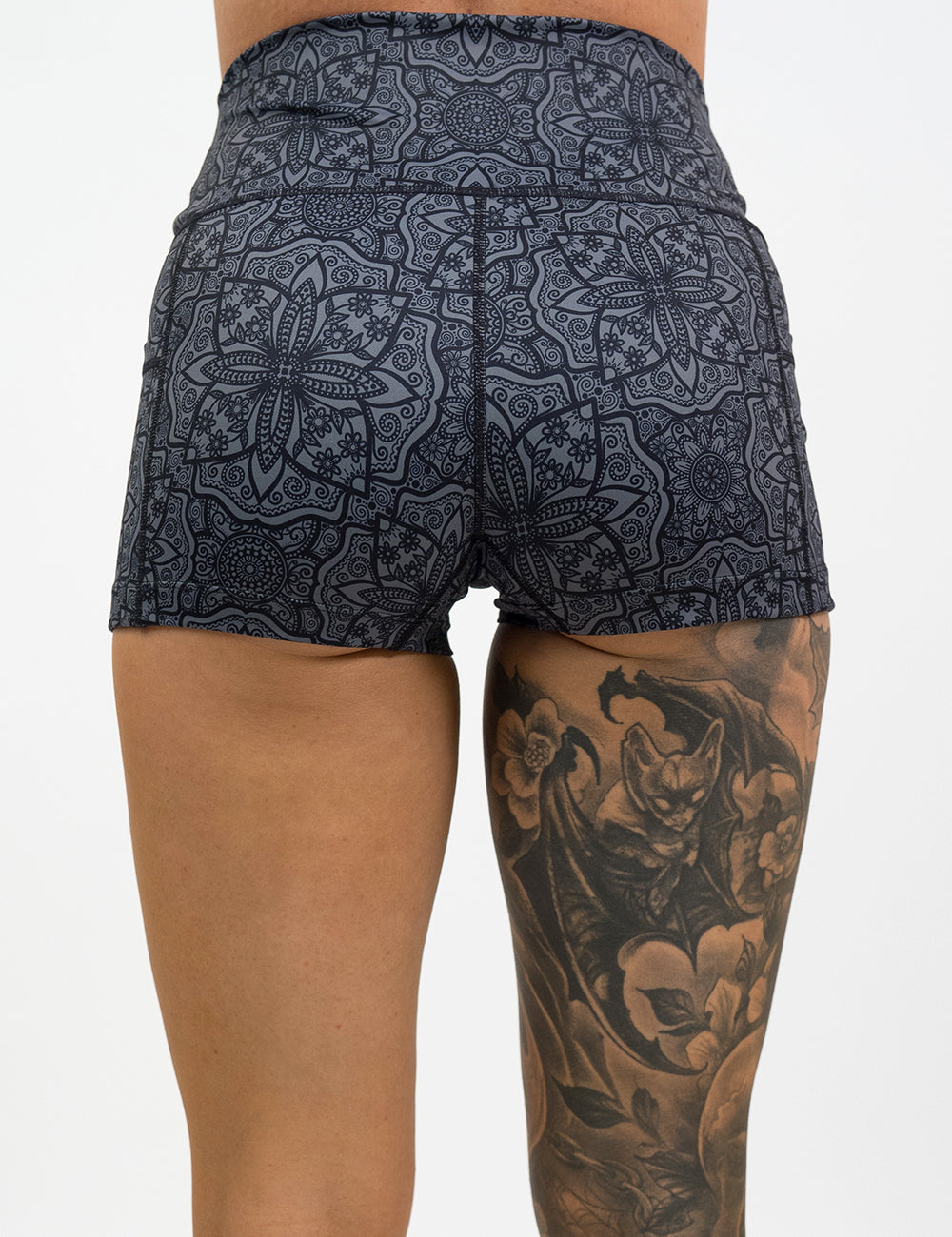 back of the 2.5 inch black mandala pattern shorts against a white background