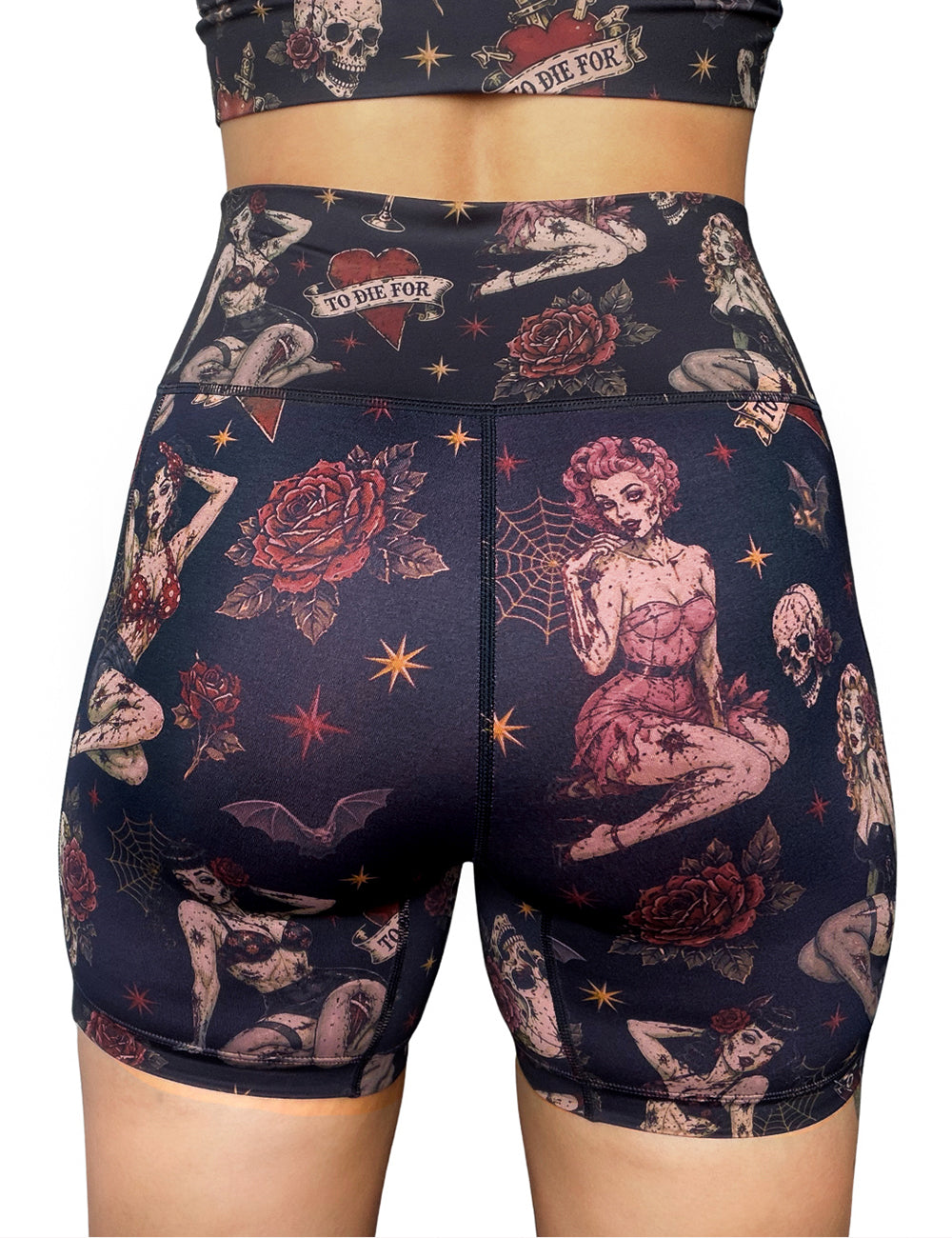back of the zombie girls with pin up hair and traditional tattoo designs 5 inch shots against a white background